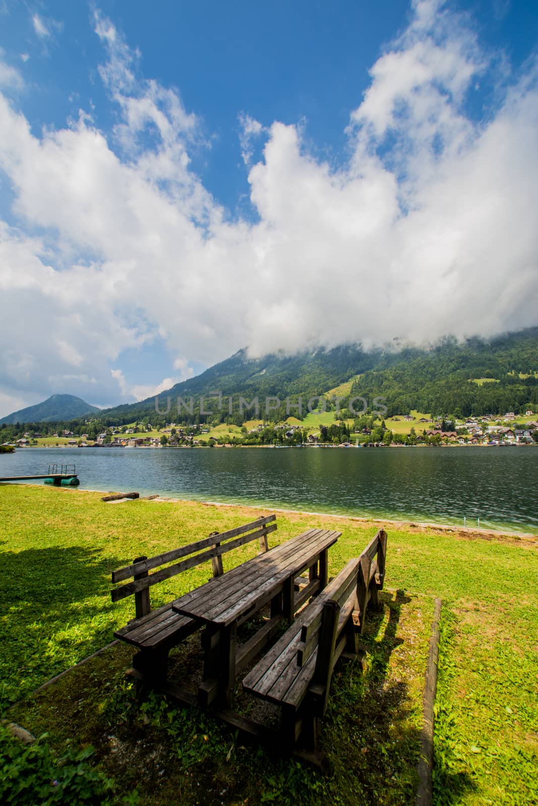 Bench at the lake in mountains Austria