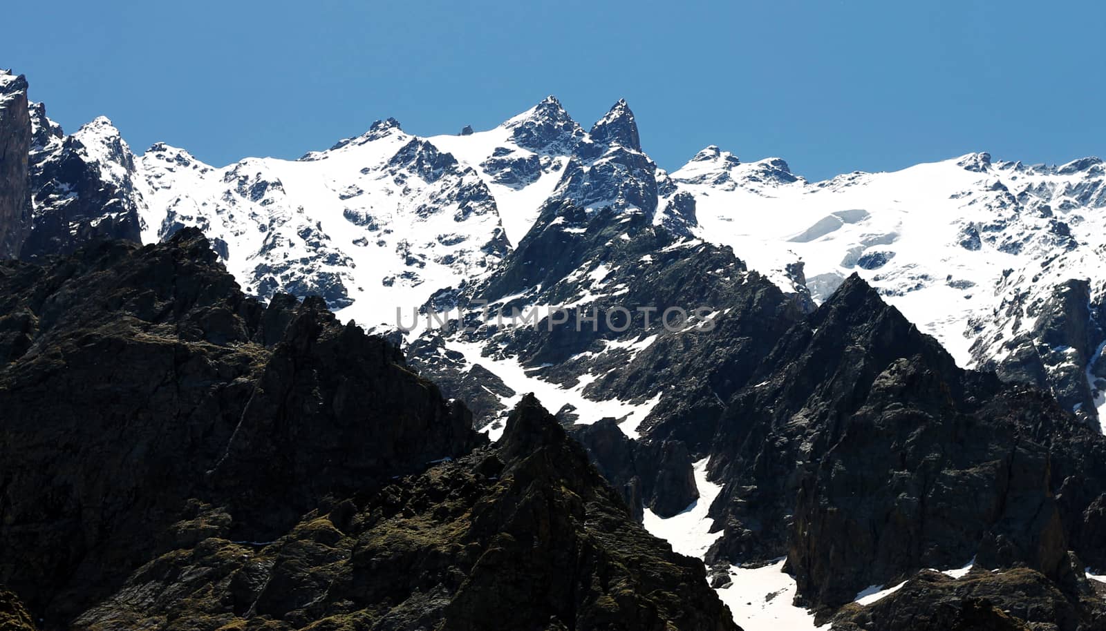 Caucasus mountains under snow and clear blue sky