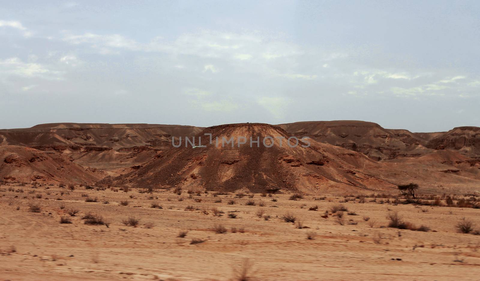 An Egyptian Desert And Mysty Sky in the daylight