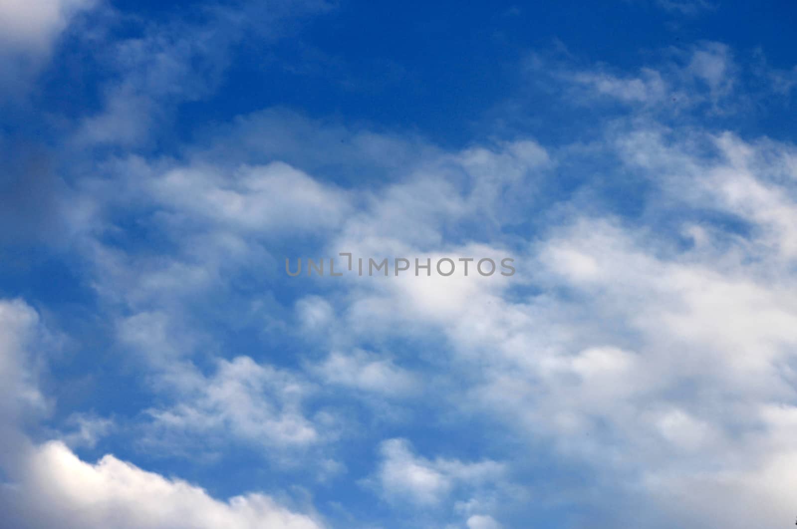 Blue sky and white clouds and the sun