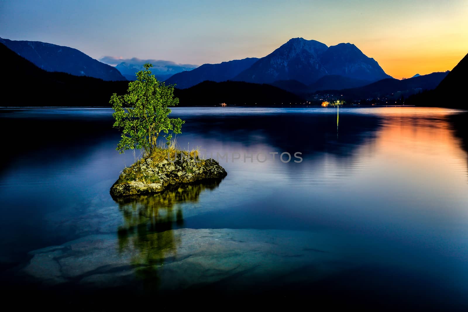 Small island on the lake in mountains Austria