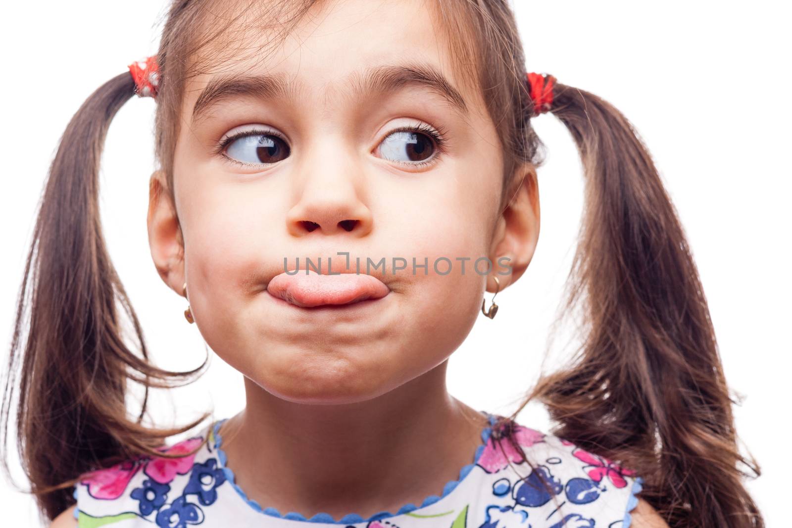 young girl on white background whit tongue stick out