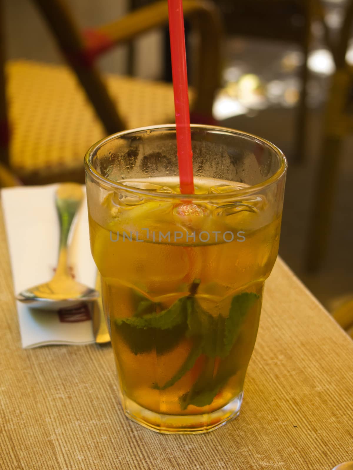 Glass of cold refreshing  ice tea served on a table