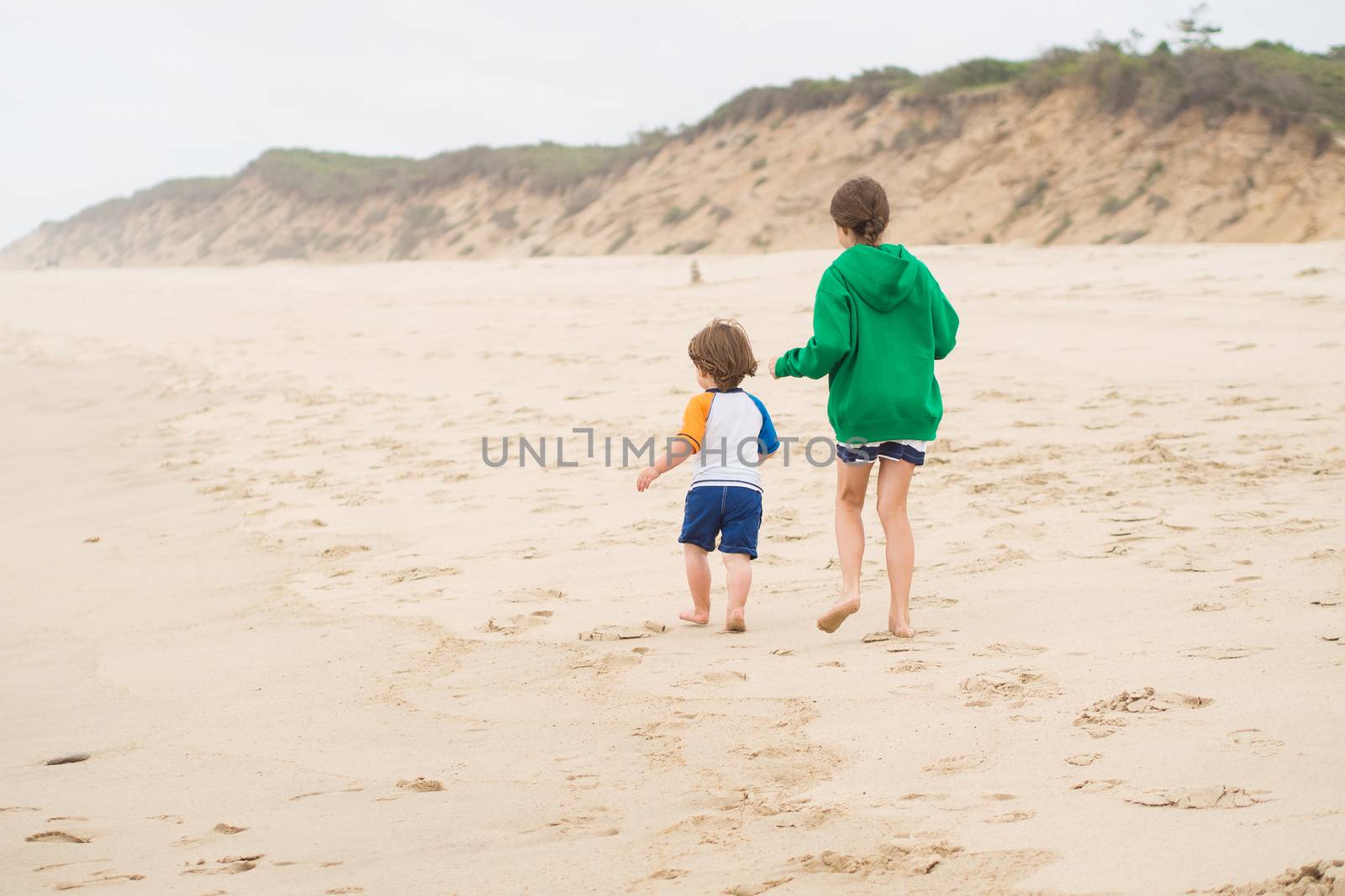 Family walk on the beach by Talanis