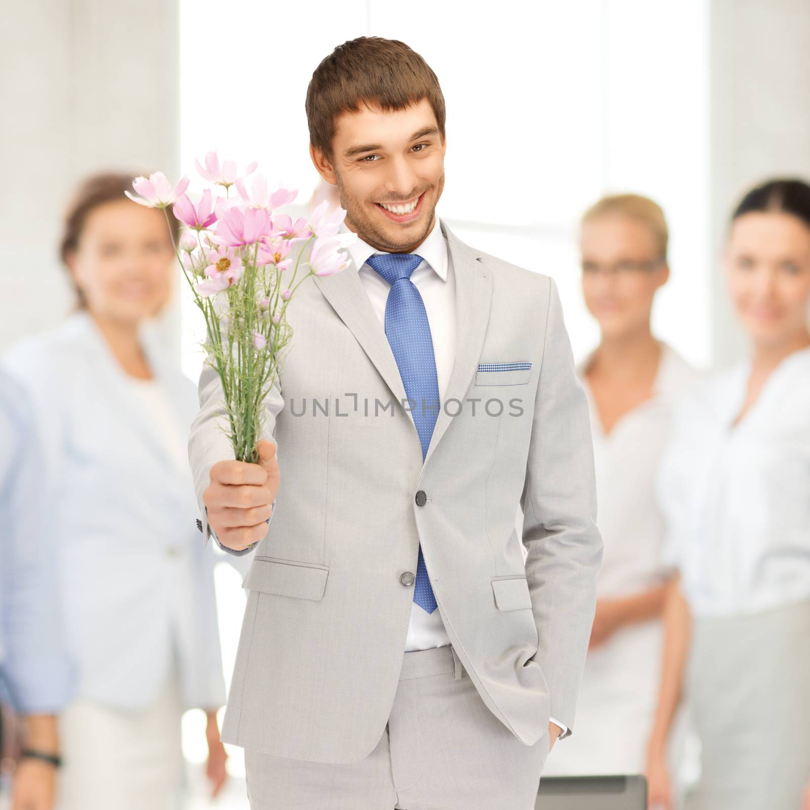 handsome man with flowers in hand by dolgachov