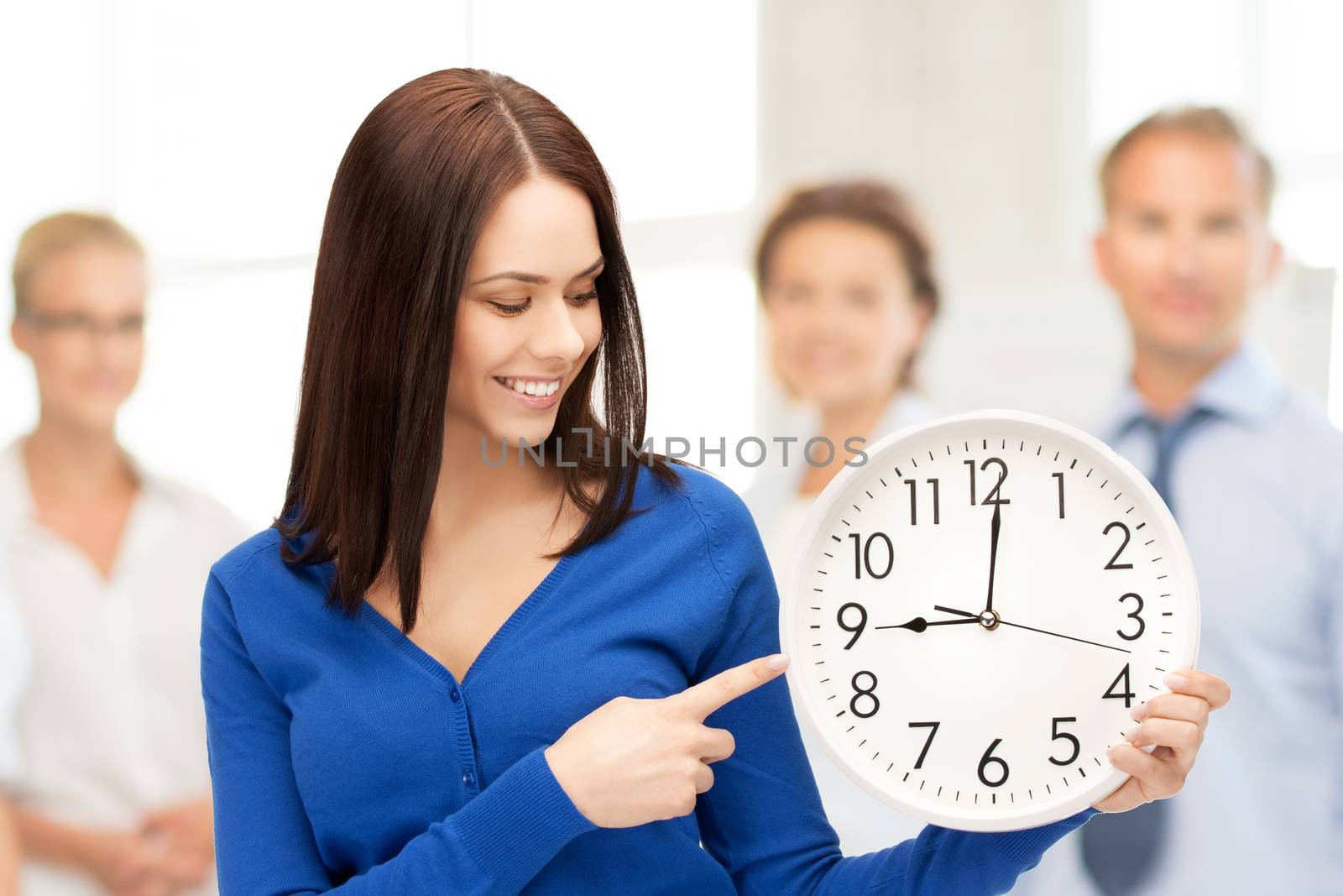 woman holding big clock by dolgachov