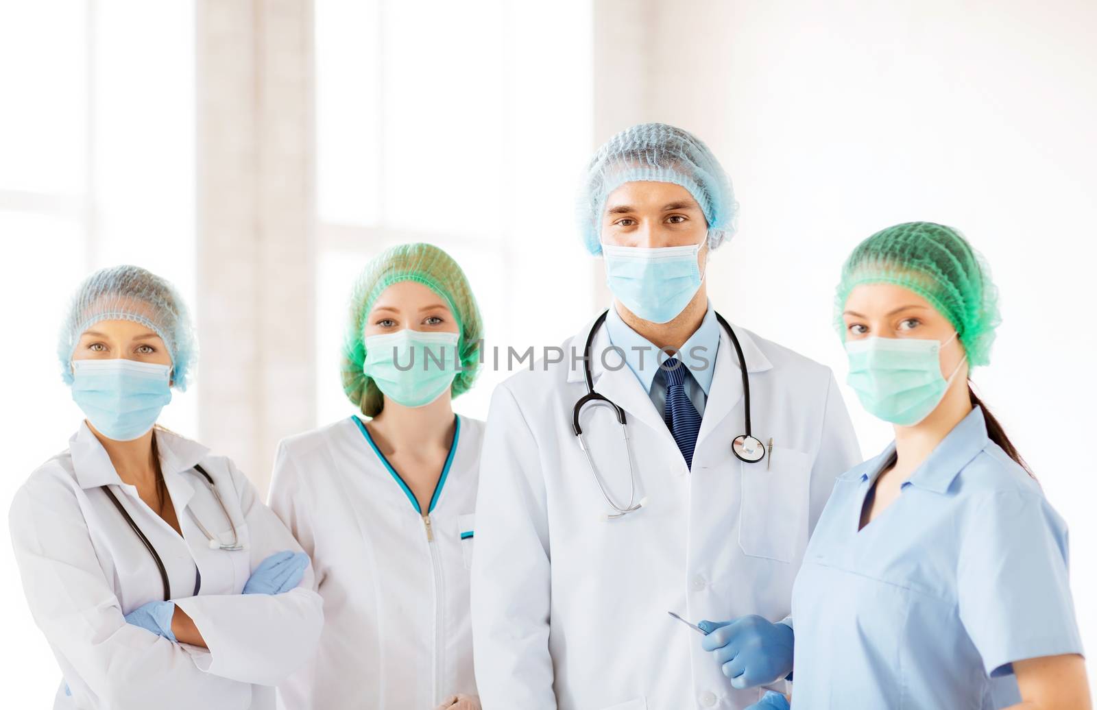 group of doctors in operating room by dolgachov