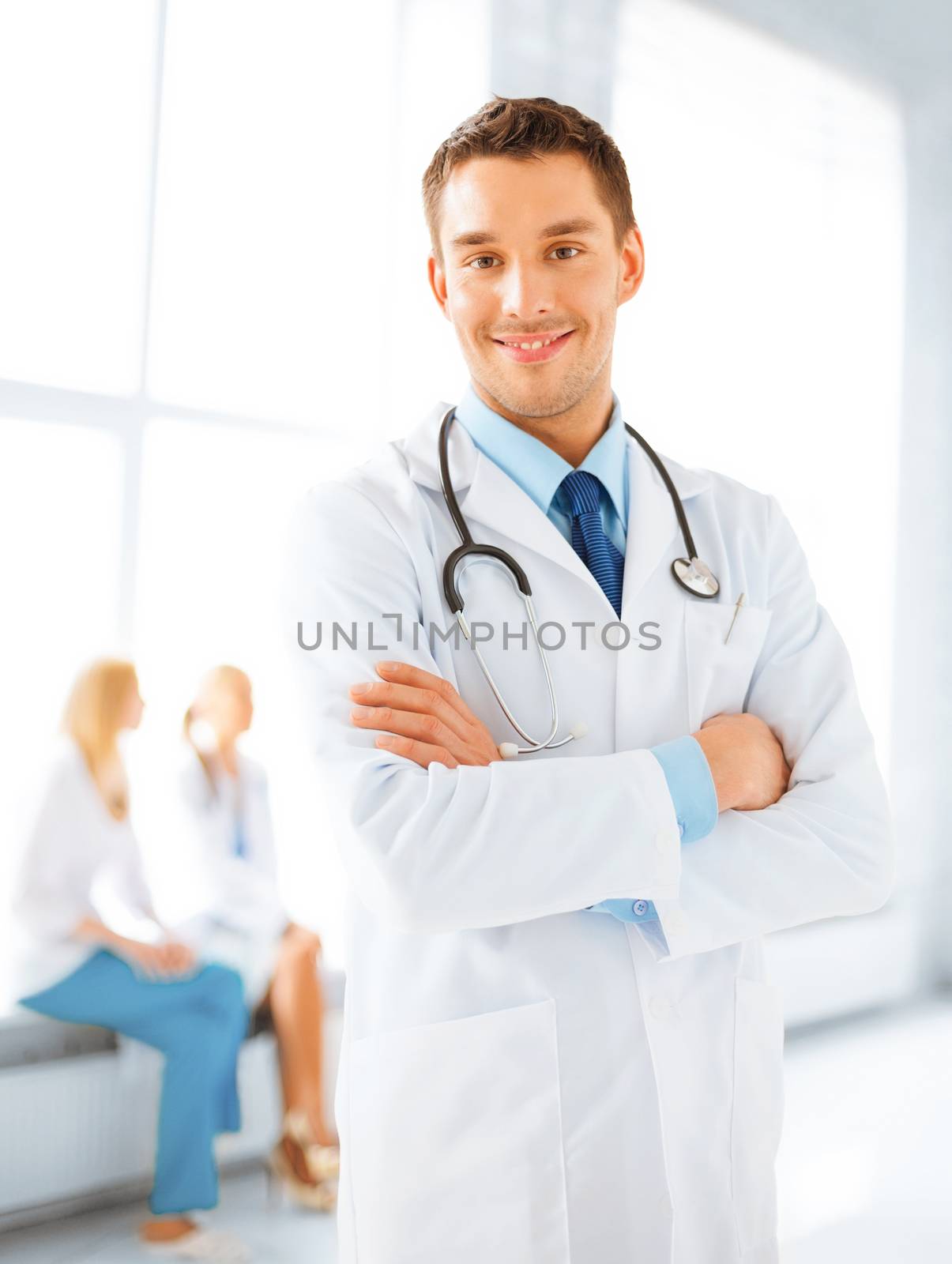 male doctor with stethoscope by dolgachov