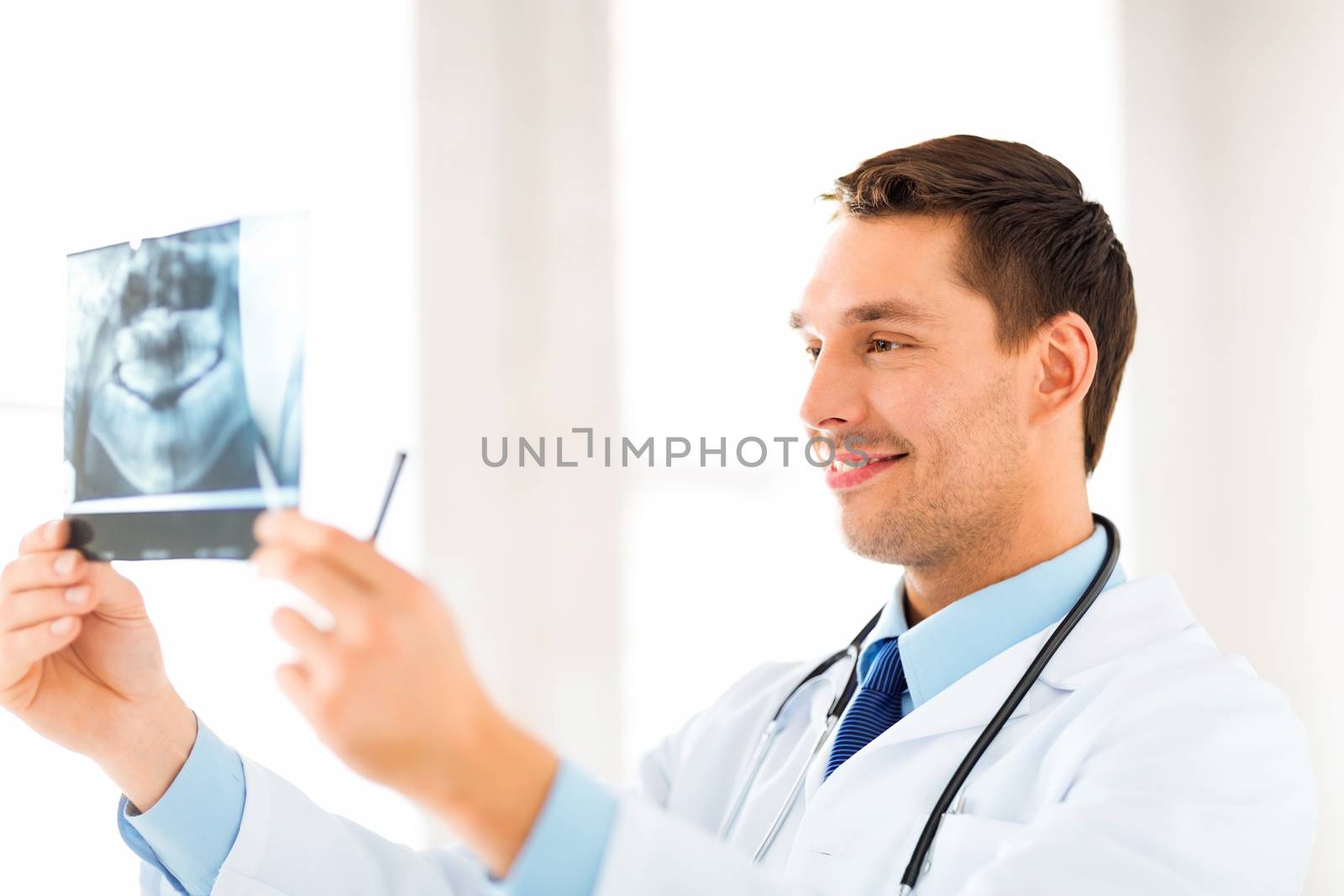 picture of male doctor or dentist with x-ray