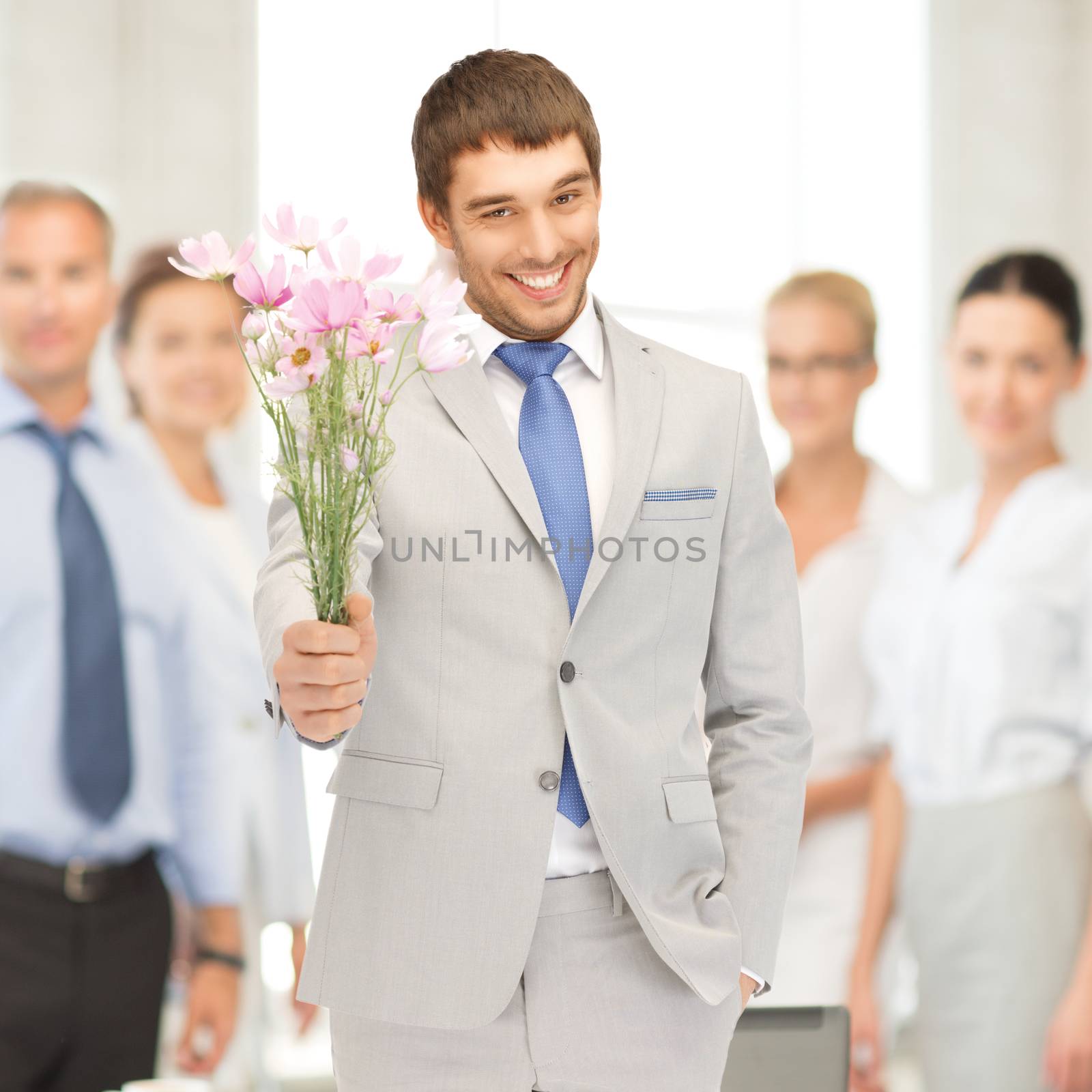 picture of handsome man with flowers in hand