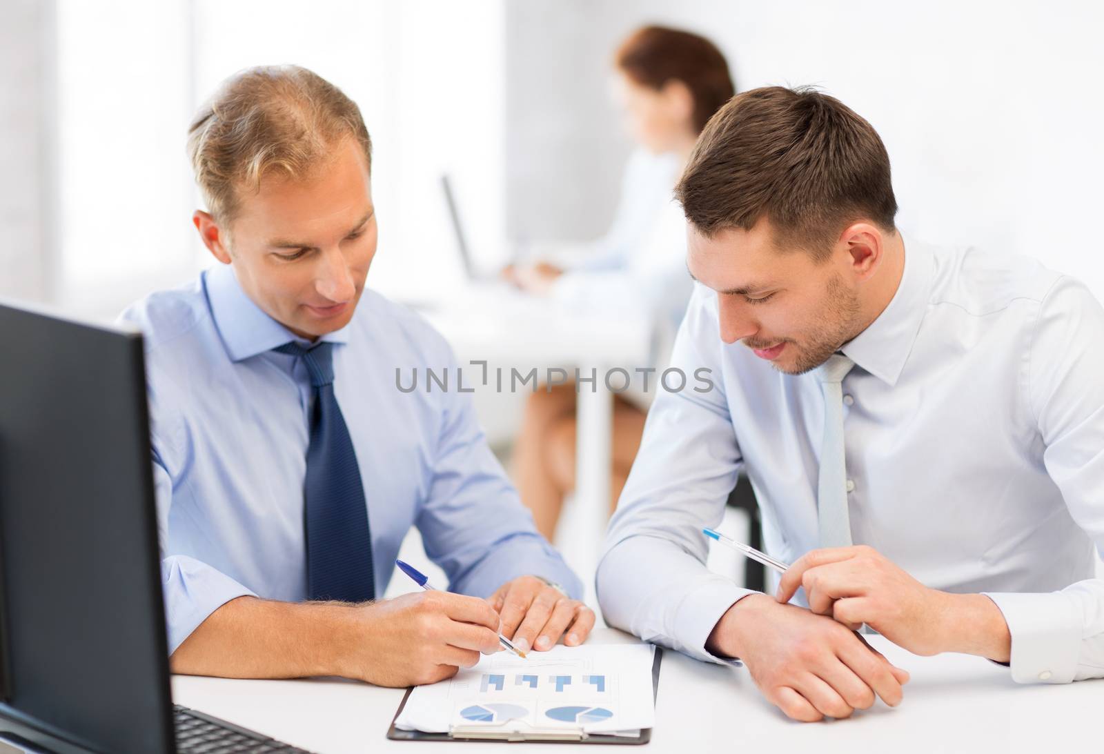businessmen with notebook on meeting by dolgachov