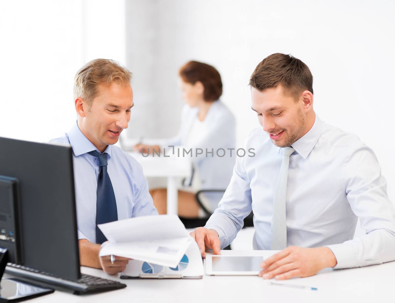 businessmen with notebook and tablet pc by dolgachov