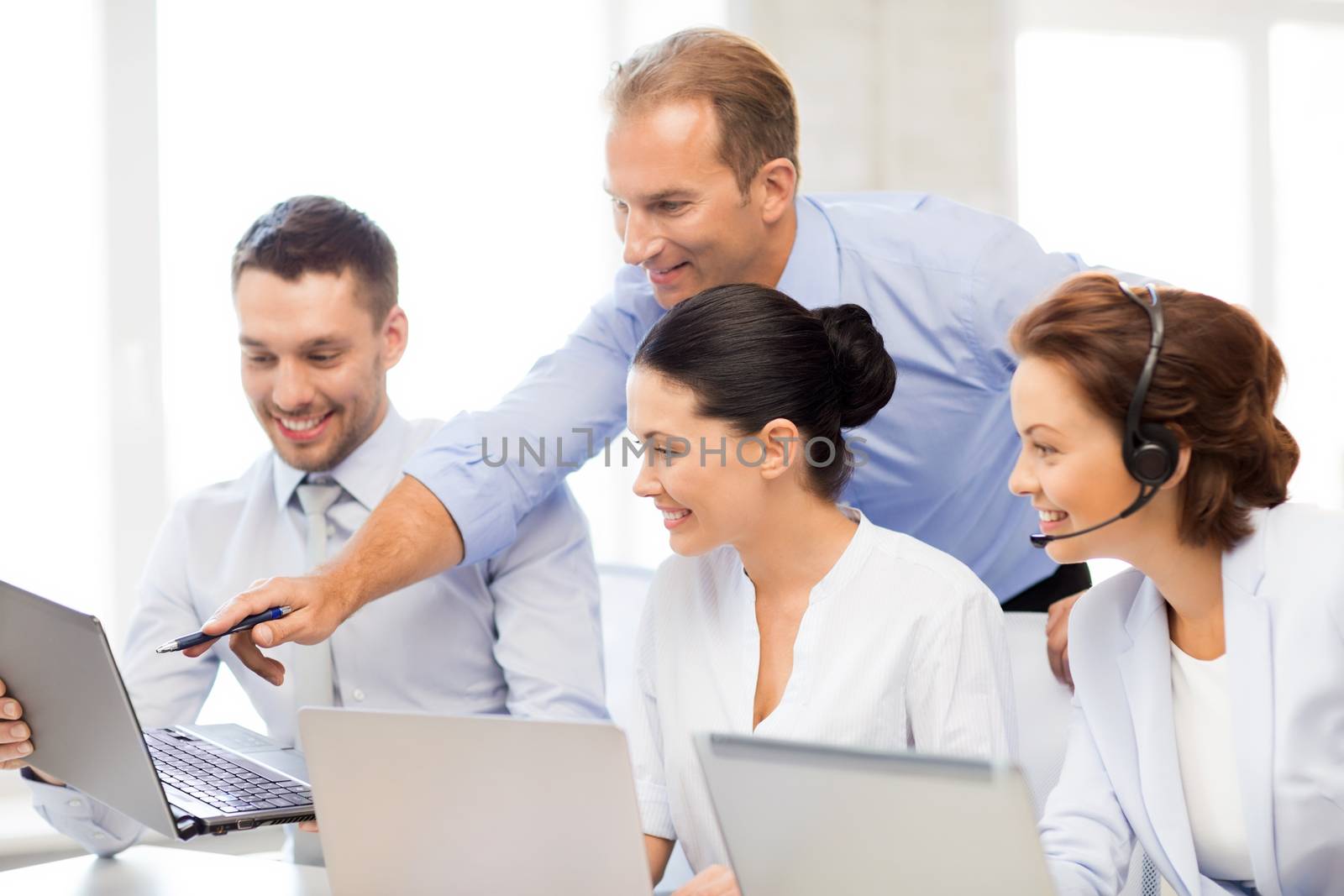 group of people working in call center by dolgachov