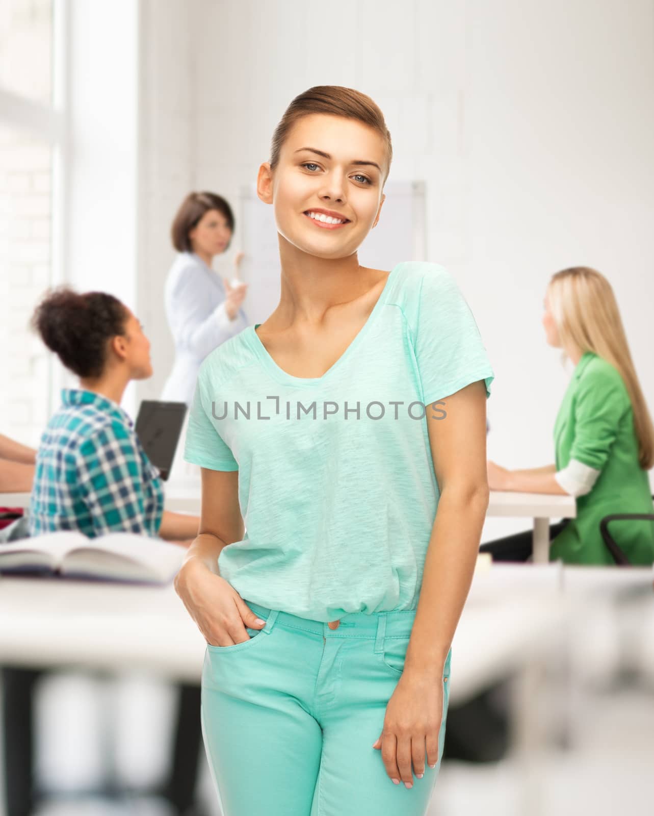 smiling girl in color t-shirt at school by dolgachov