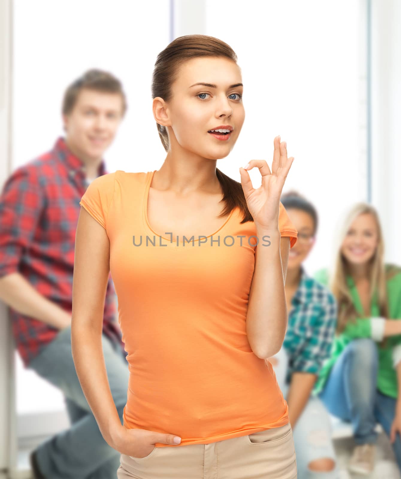 woman in blank color t-shirt showing ok gesture by dolgachov