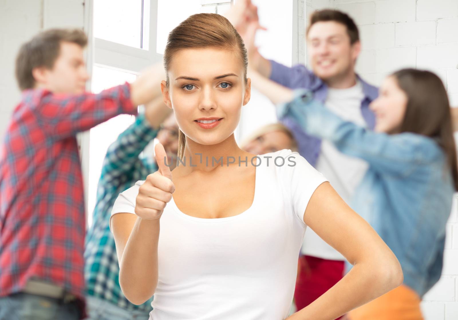 woman showing thumbs up by dolgachov