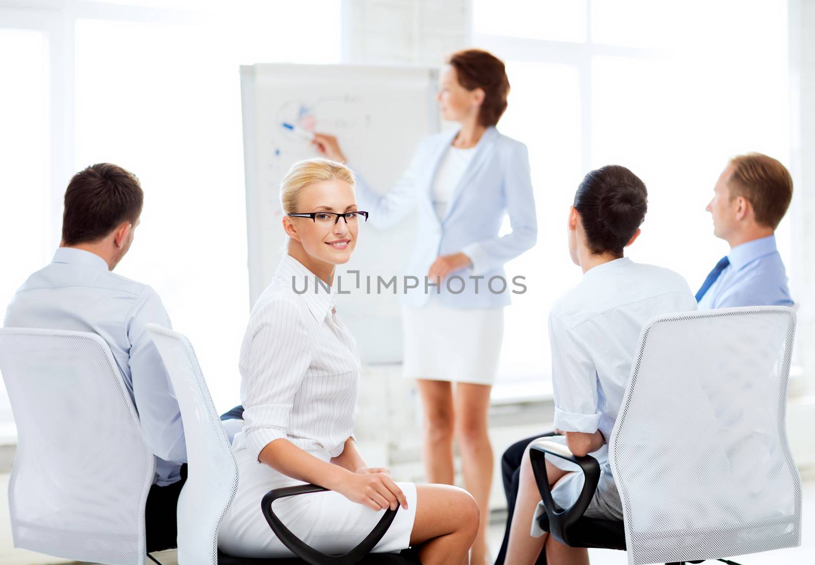 picture of smiling businesswoman on business meeting in office