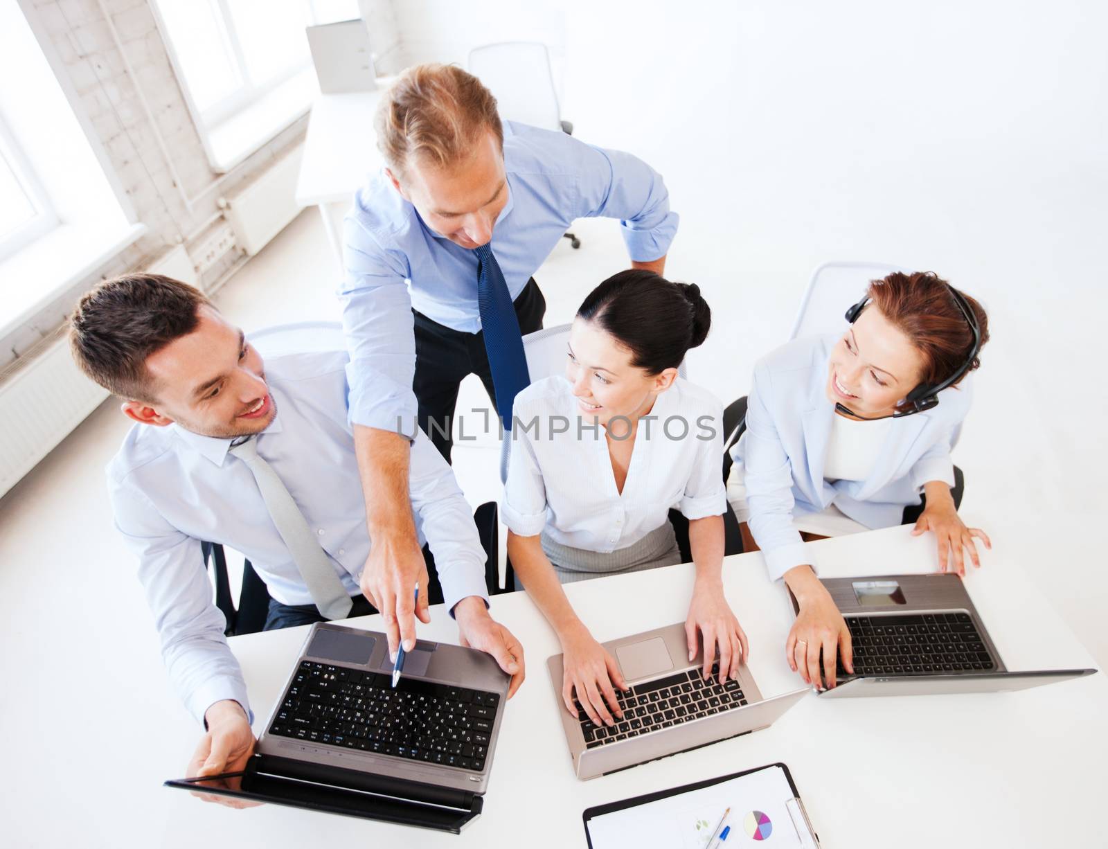 business concept - group of people working in call center or office