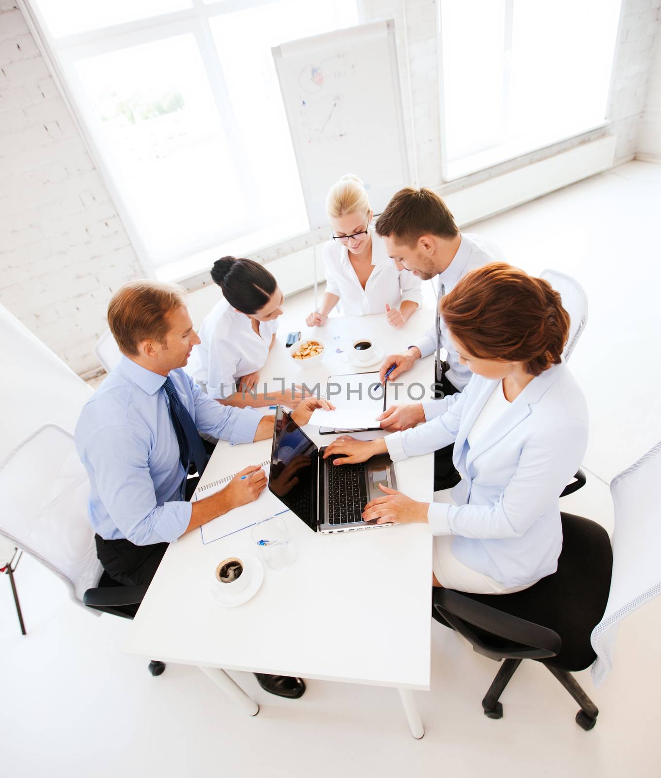 business team having meeting in office by dolgachov