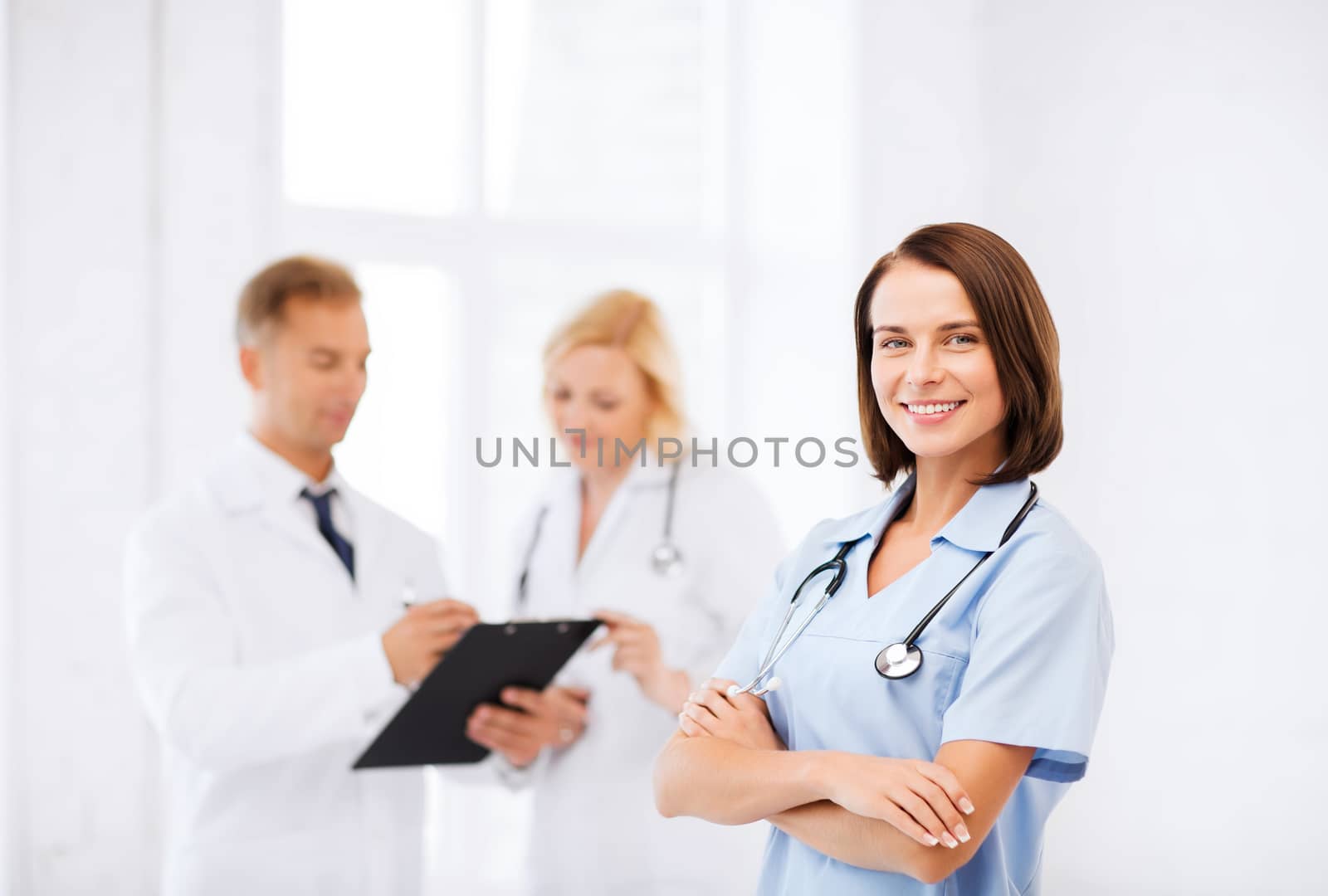 young female doctor with stethoscope by dolgachov