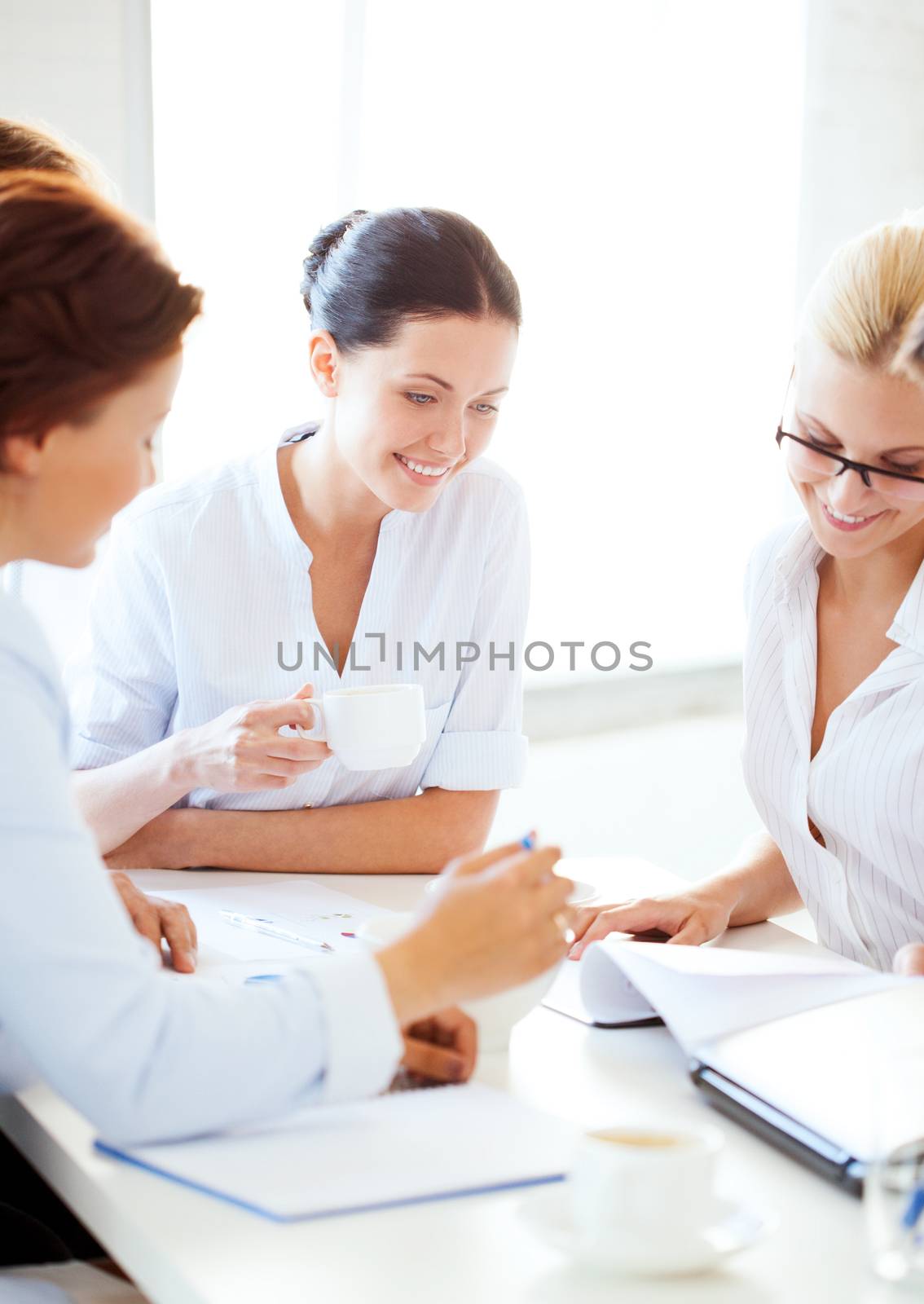 businesswoman with team on meeting in office by dolgachov