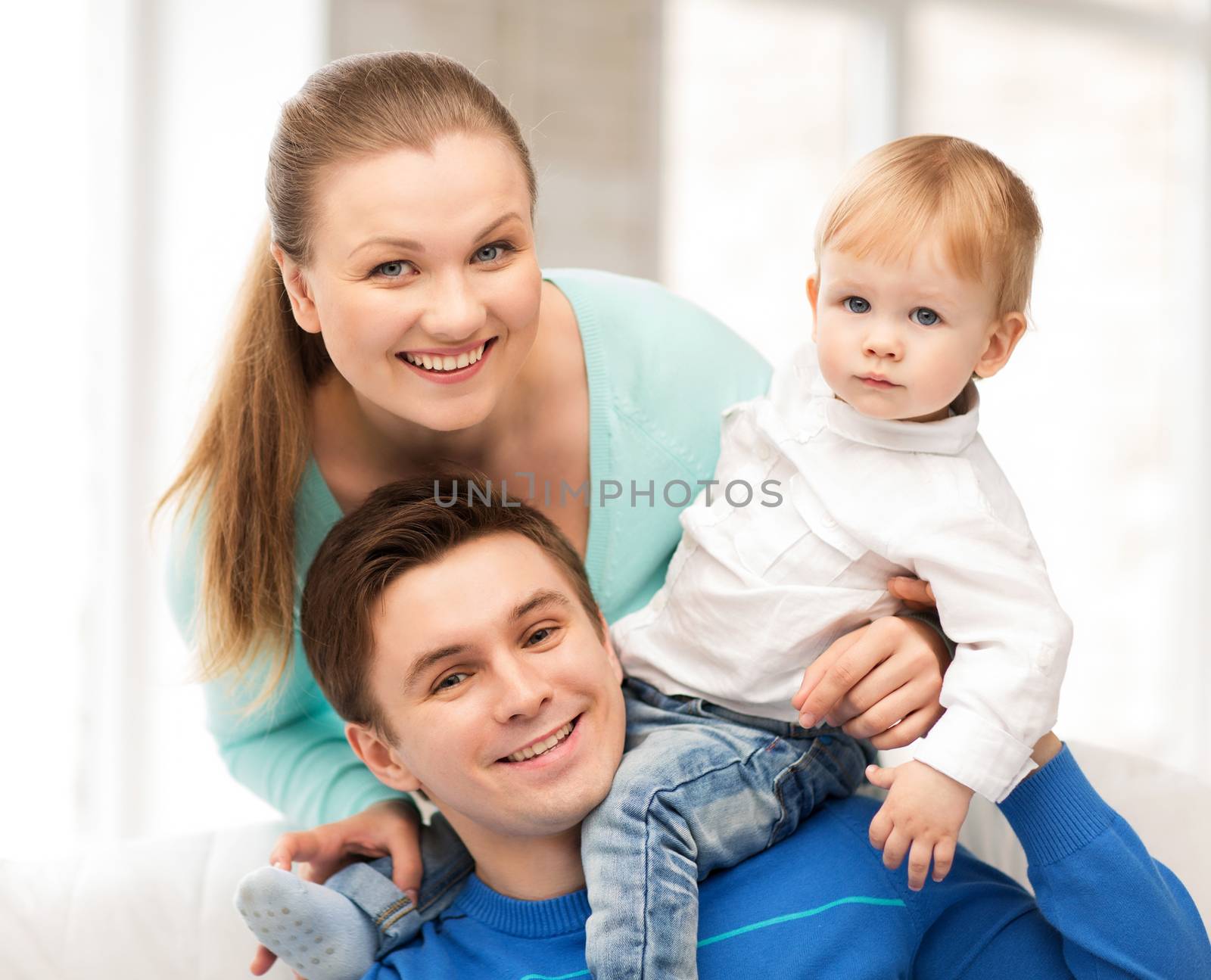 picture of happy parents playing with adorable baby