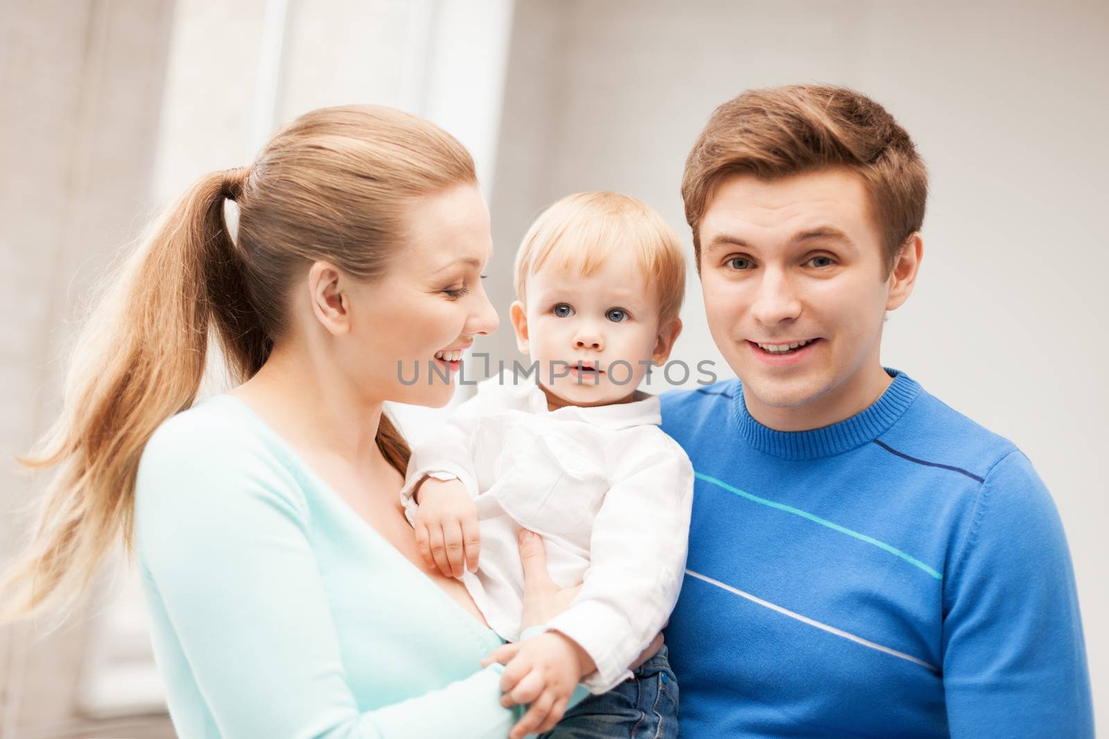 happy family with adorable baby by dolgachov