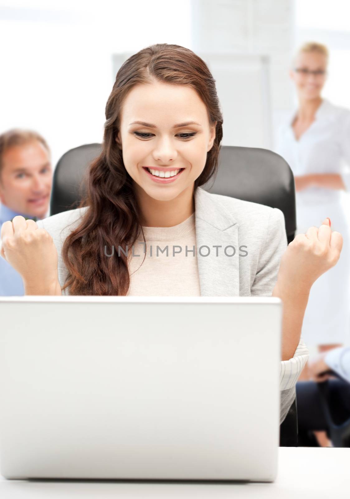 businesswoman with computer in office by dolgachov