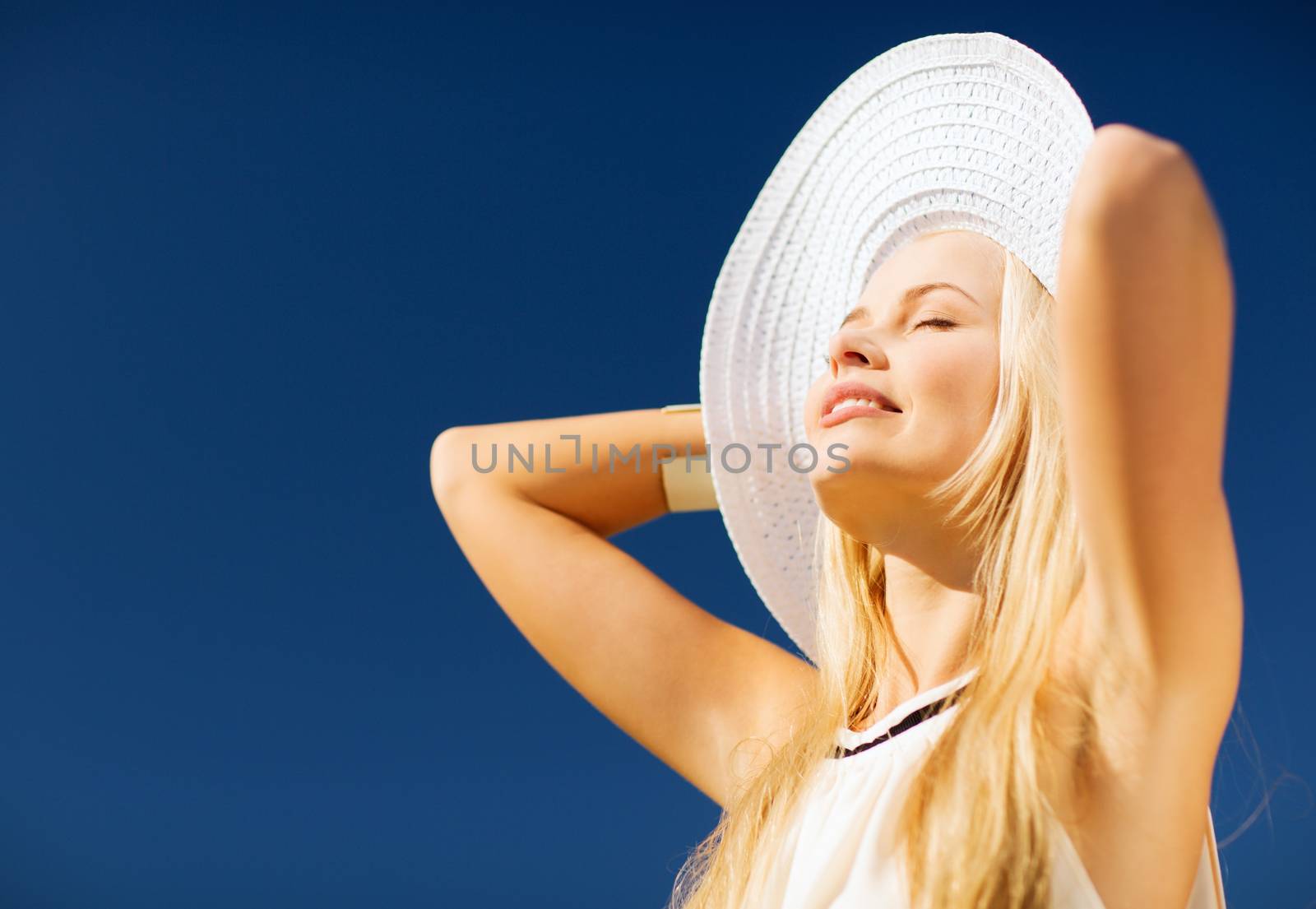 beautiful woman enjoying summer outdoors by dolgachov