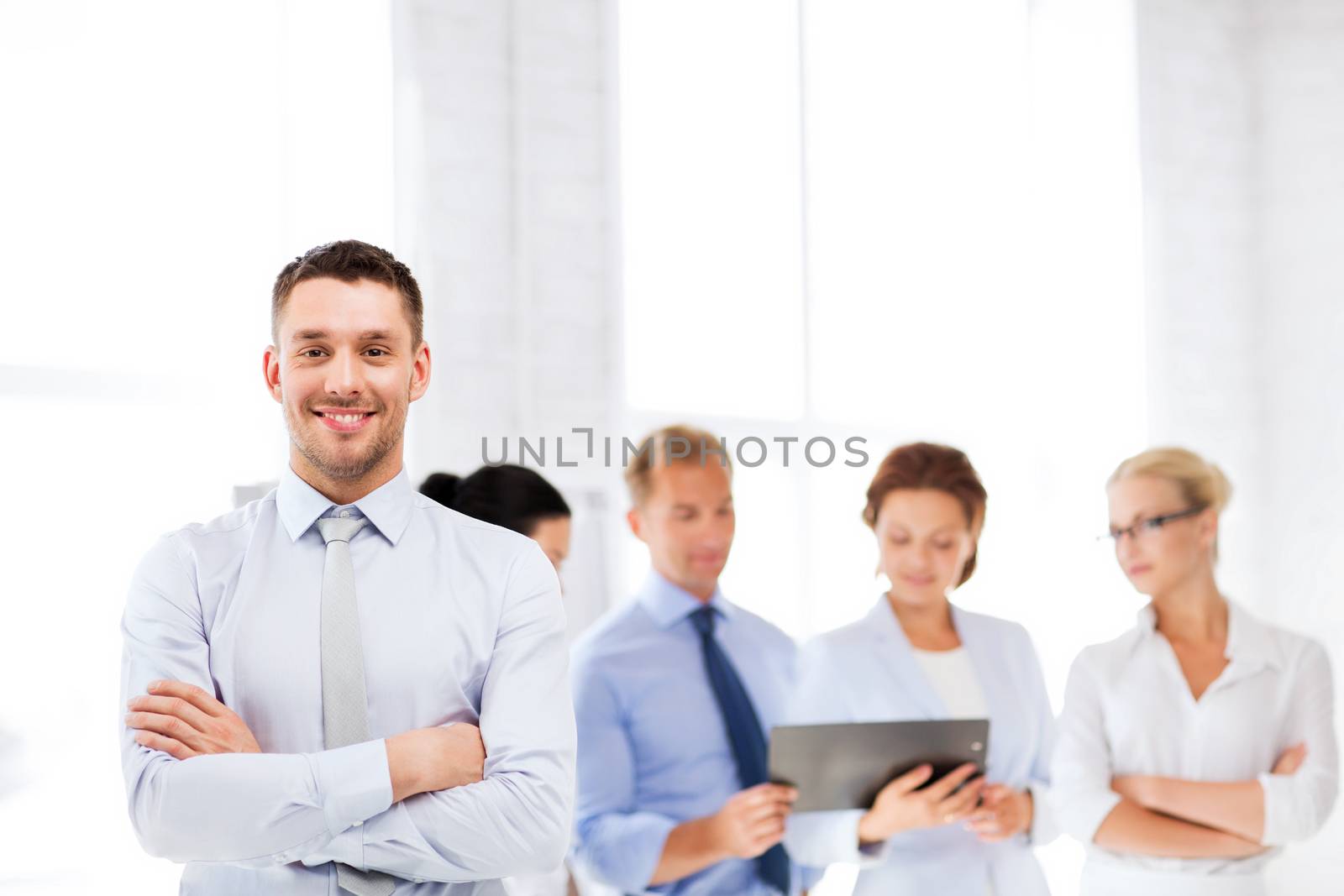 picture of smiling handsome businessman in office