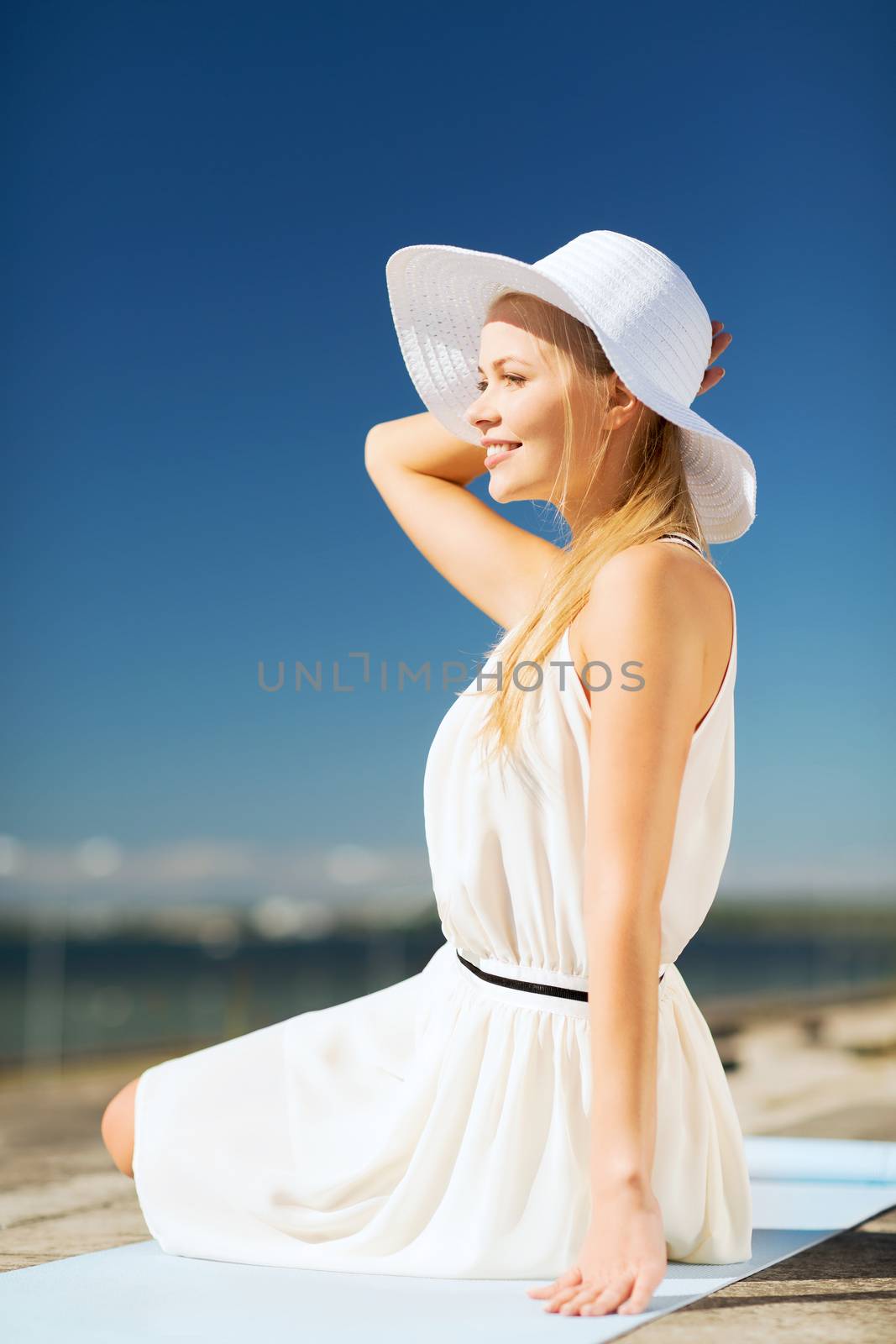 beautiful woman enjoying summer outdoors by dolgachov