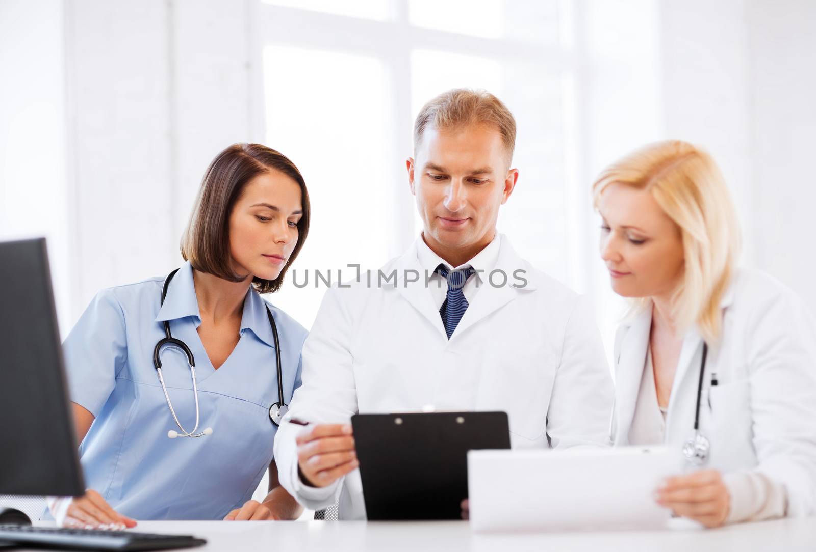 healthcare and medical concept - team or group of doctors on meeting