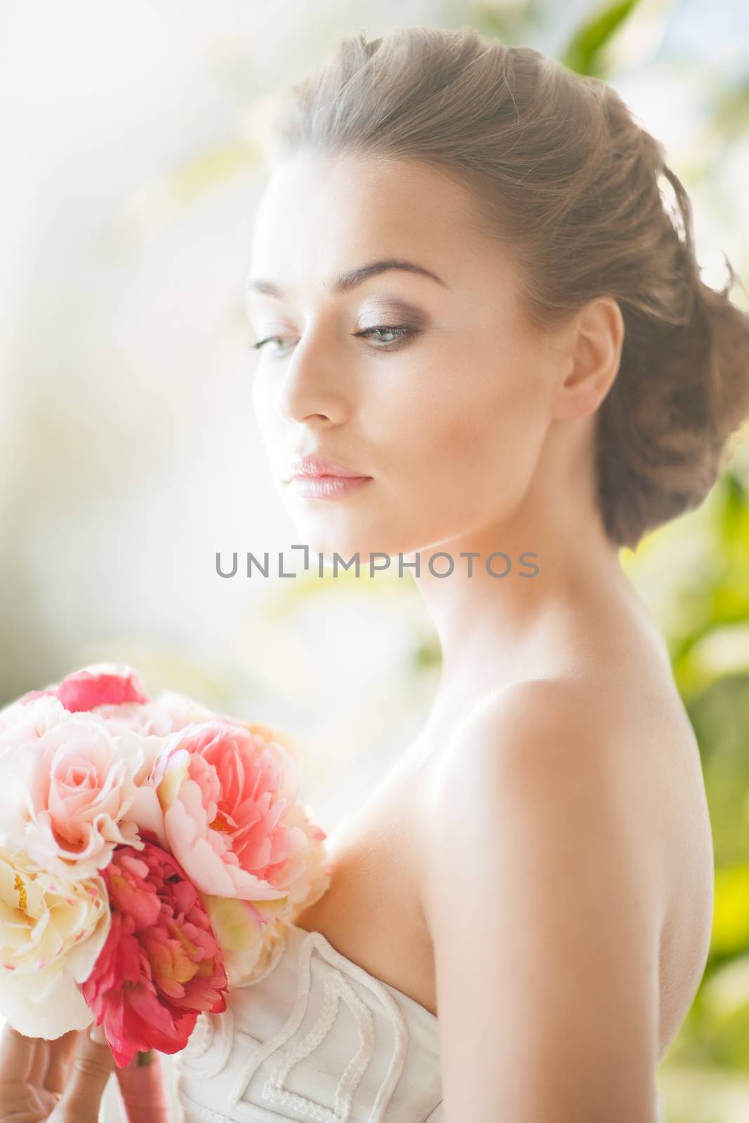 wedding and beauty concept - young woman with bouquet of flowers