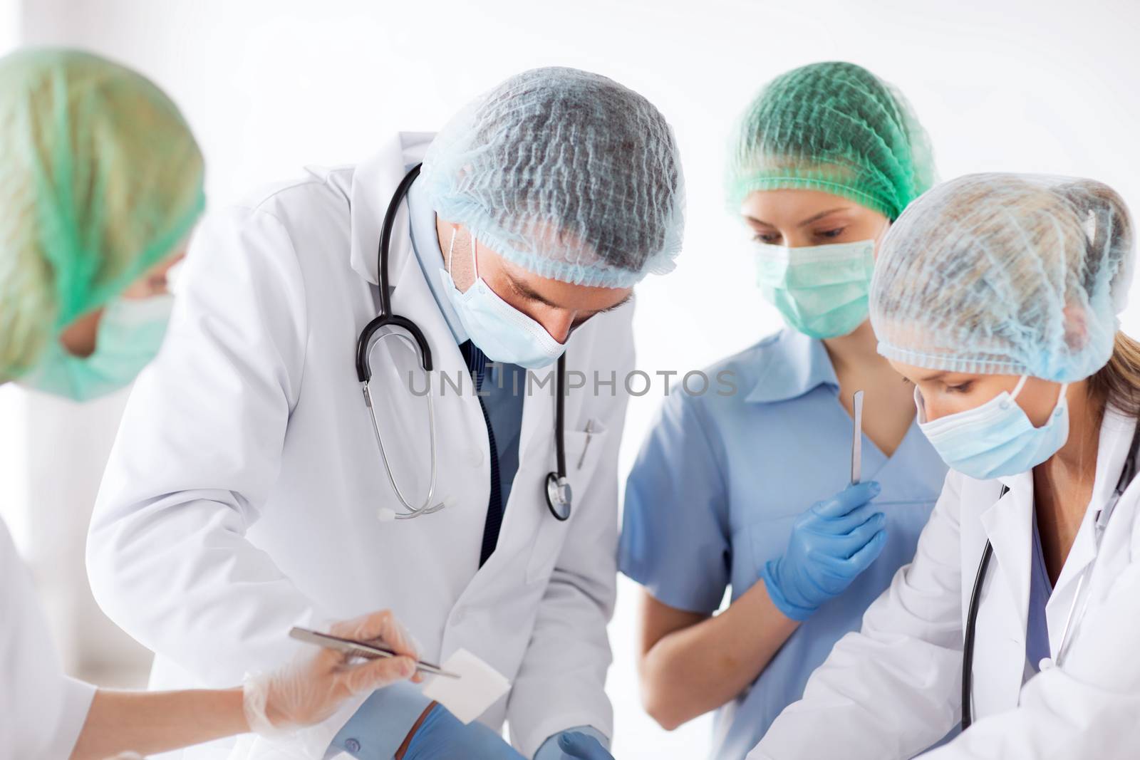 young group of doctors doing operation by dolgachov