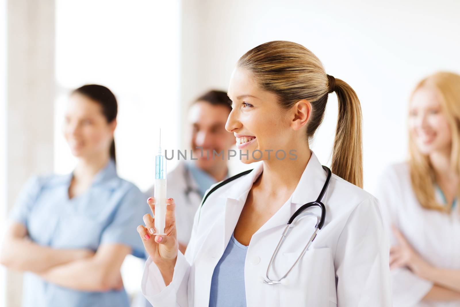 female doctor holding syringe with injection by dolgachov