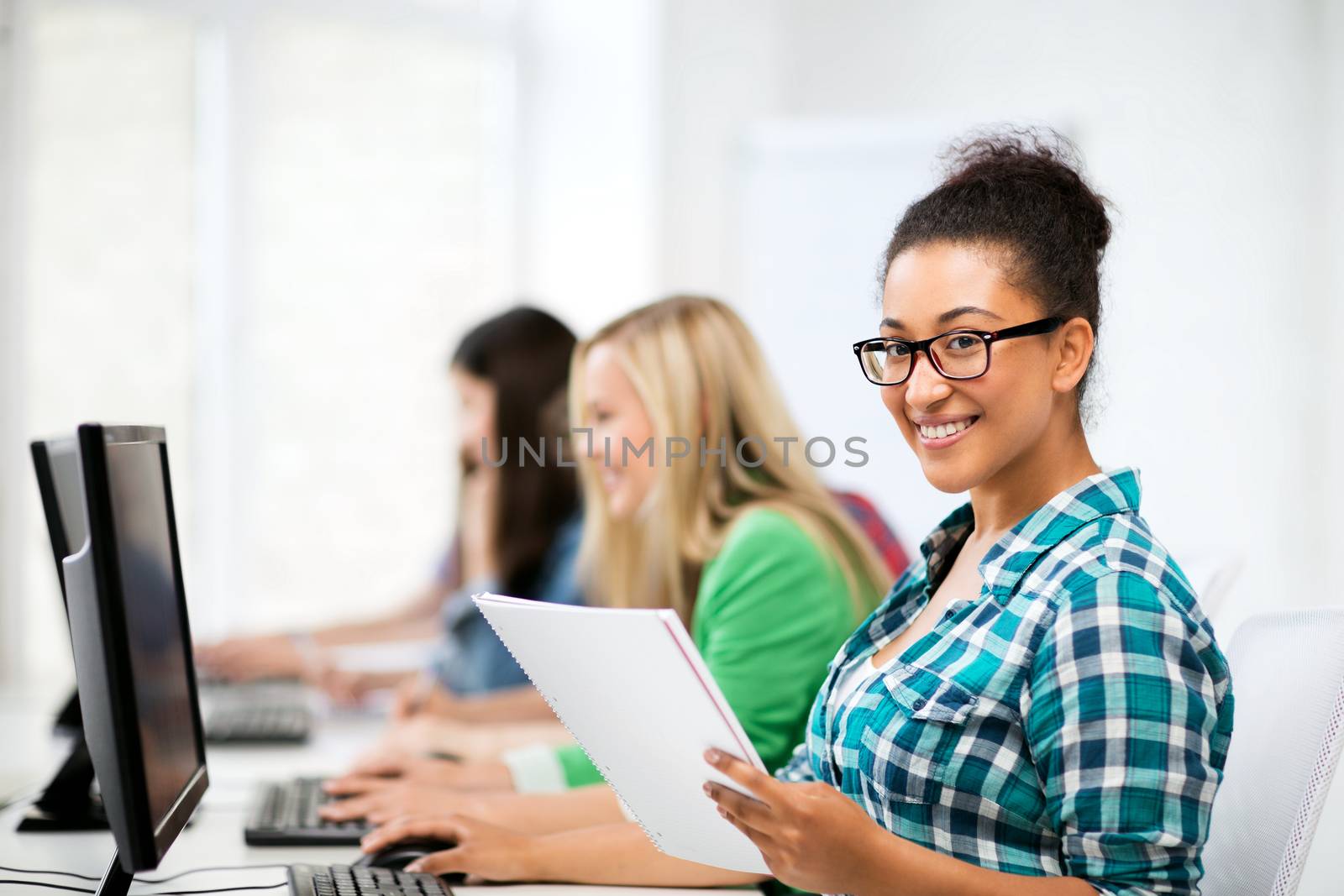 education, technology and internet - african student with computer studying at school