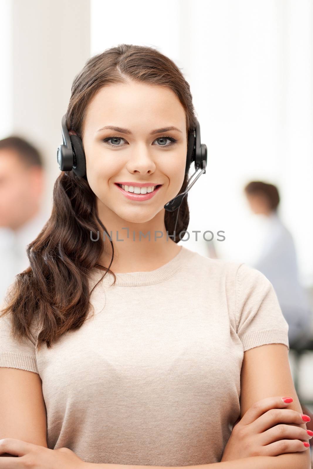 helpline operator with headphones in call centre by dolgachov