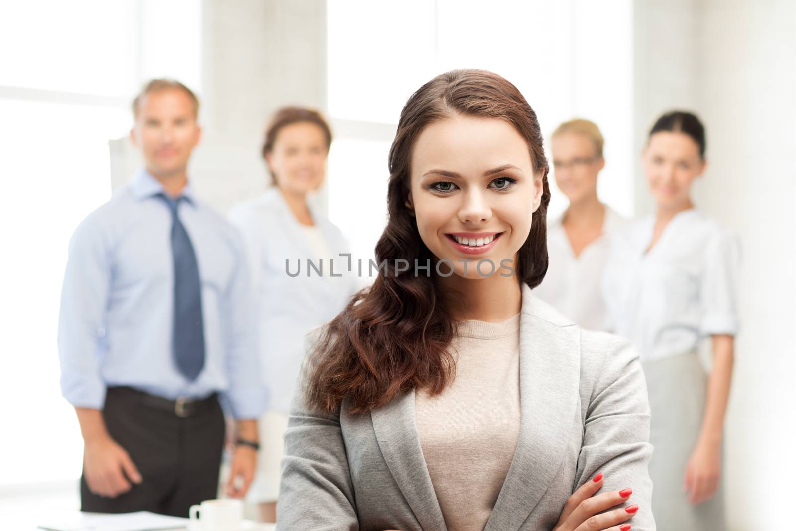 attractive young businesswoman in office by dolgachov