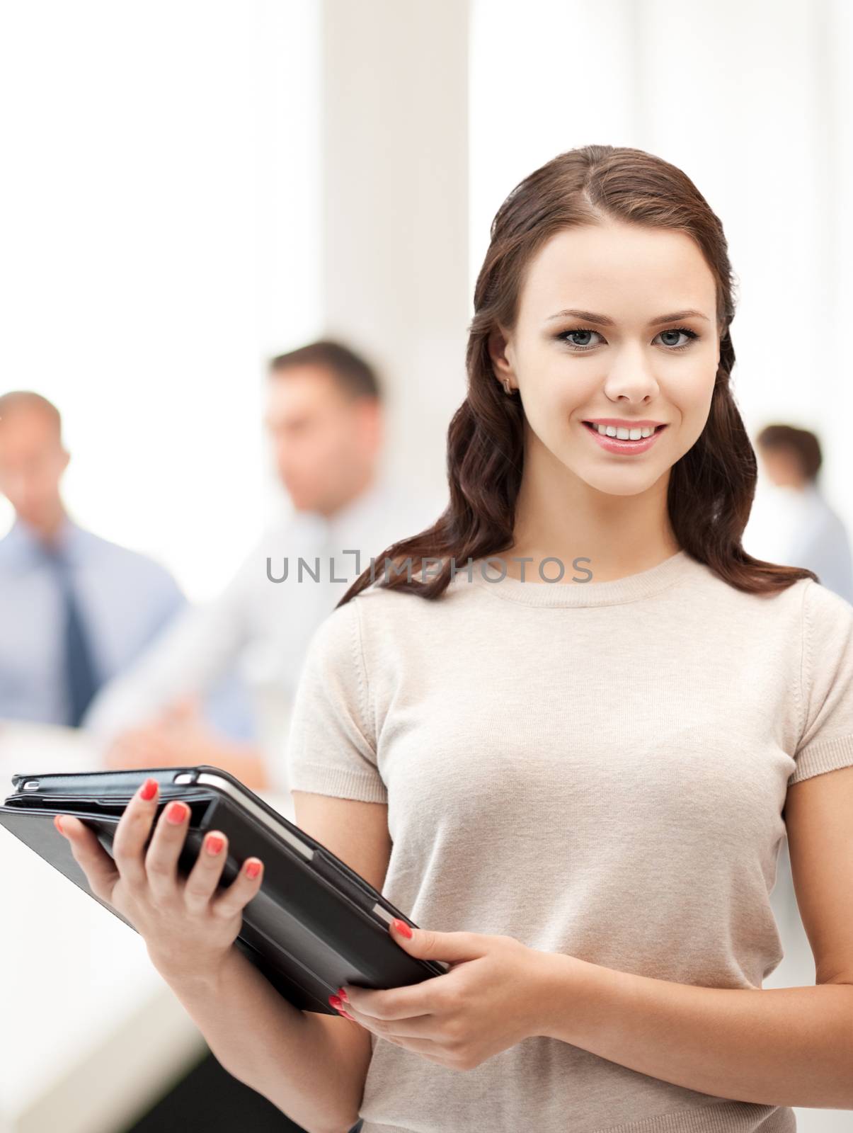 businesswoman with tablet pc in office by dolgachov
