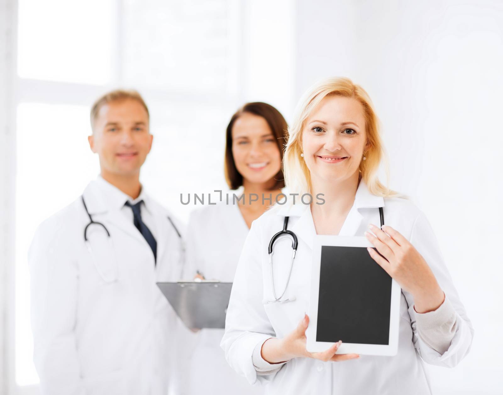 healthcare, medical and technology concept - female doctor with tablet pc