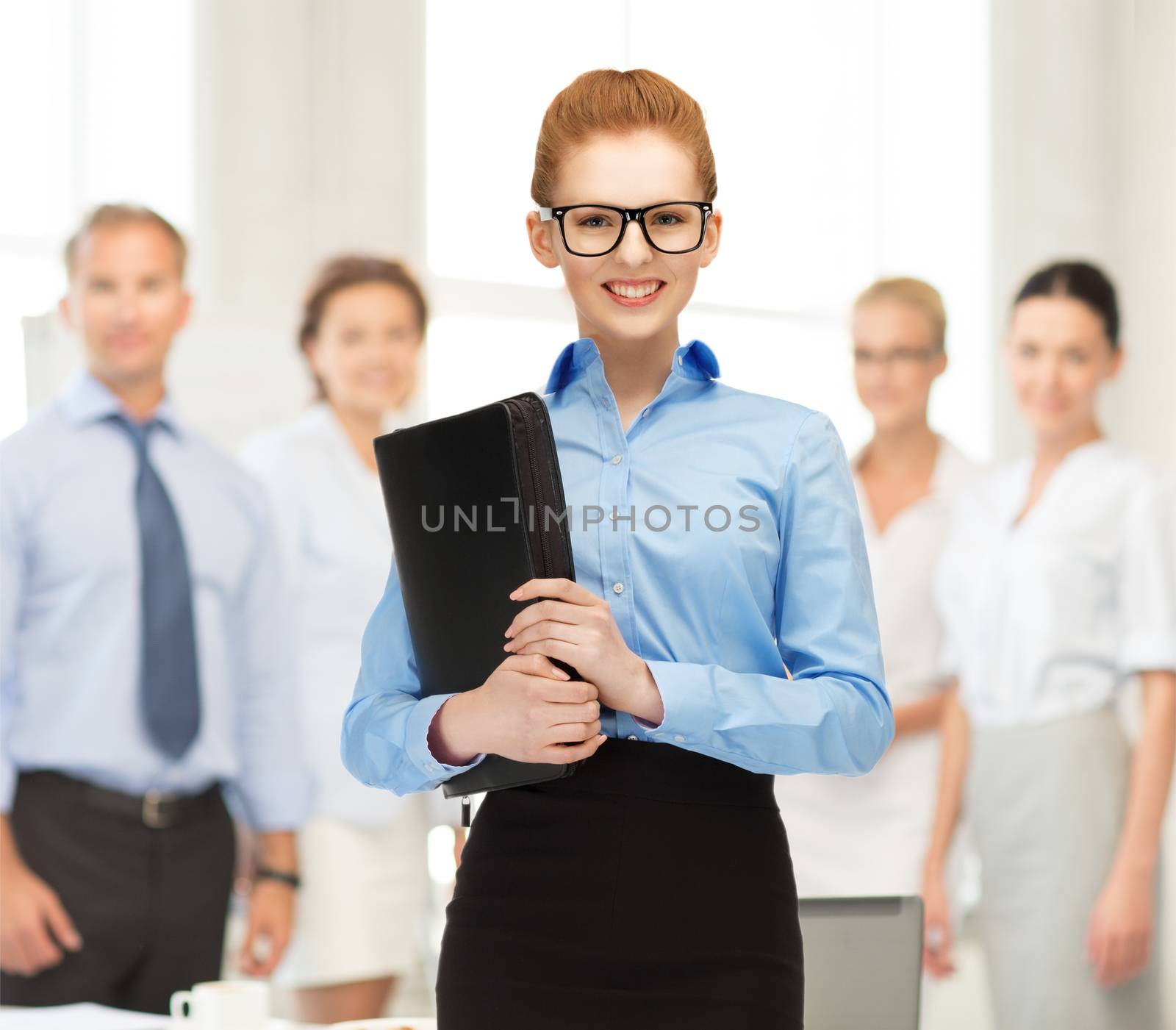 businesswoman with tablet pc in office by dolgachov