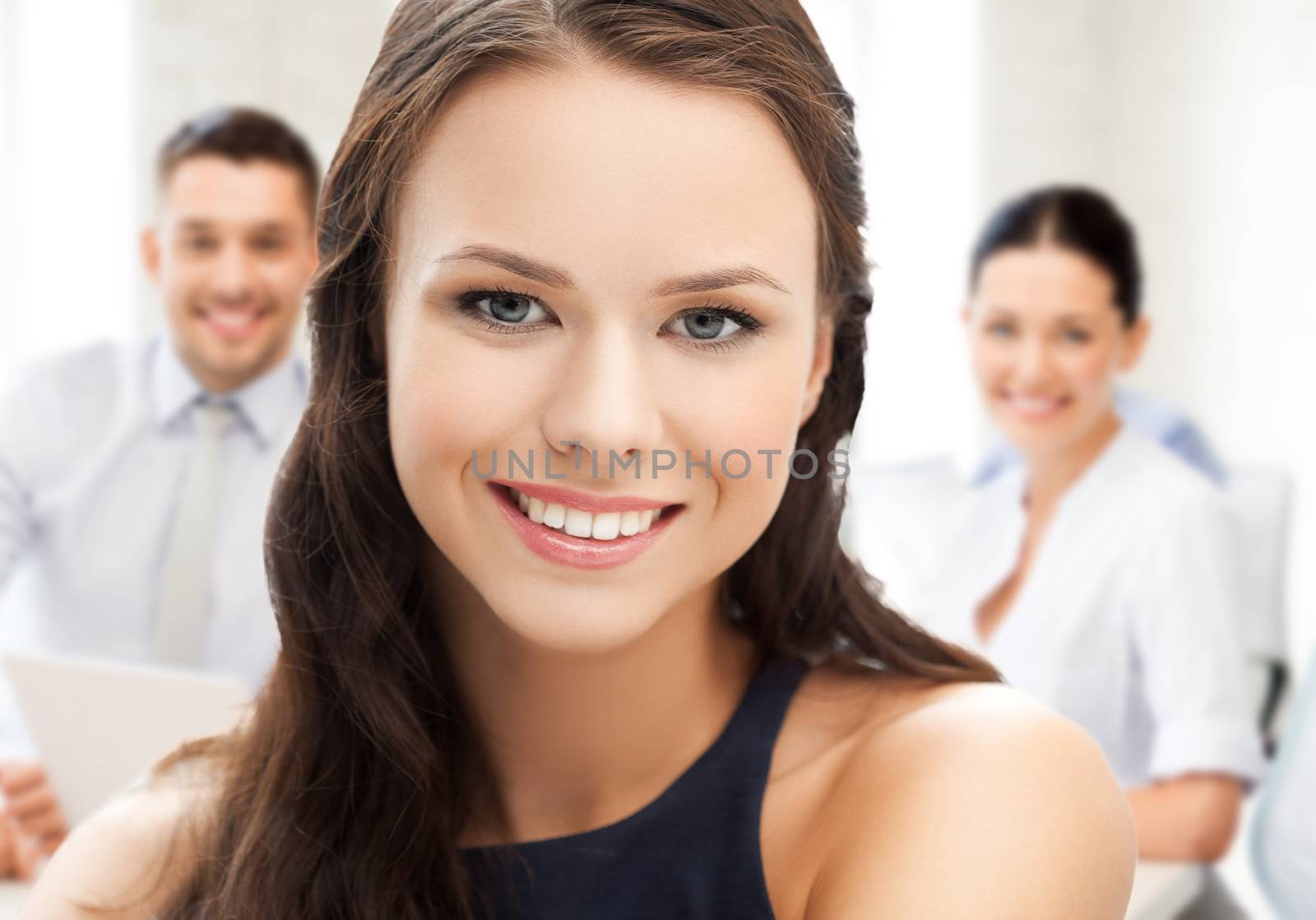 attractive young businesswoman in office by dolgachov