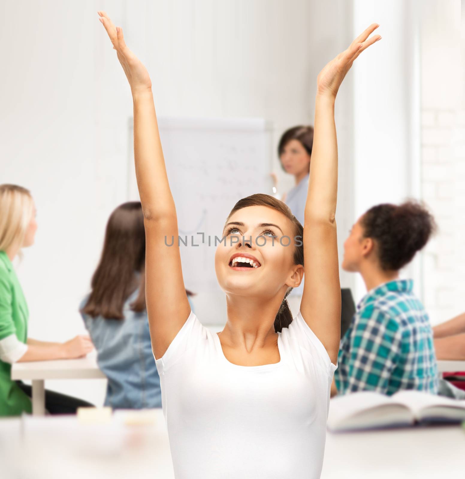 education and success concept - happy student girl with hands up