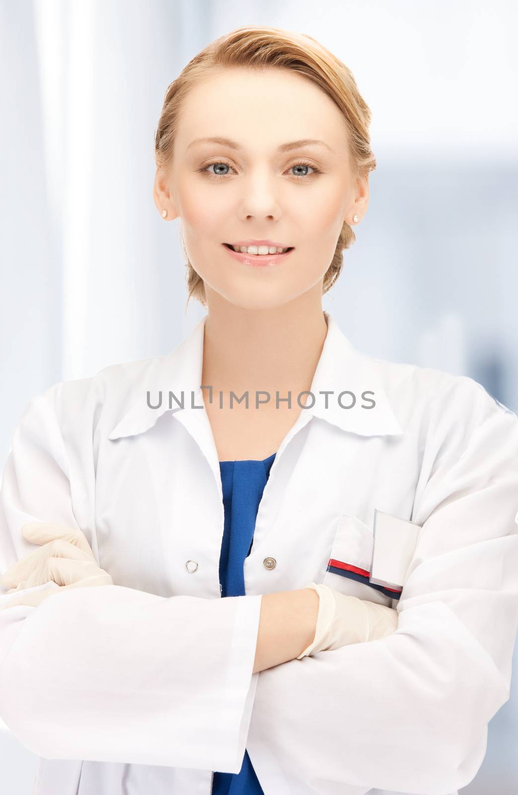 smiling female doctor in hospital by dolgachov