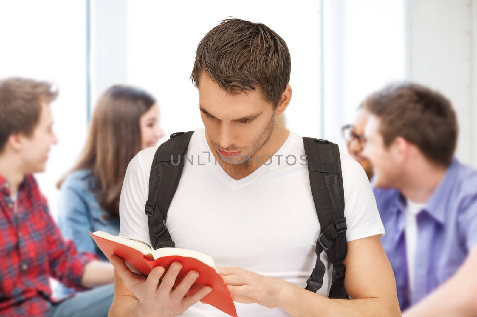 education concept - student boy reading book at school