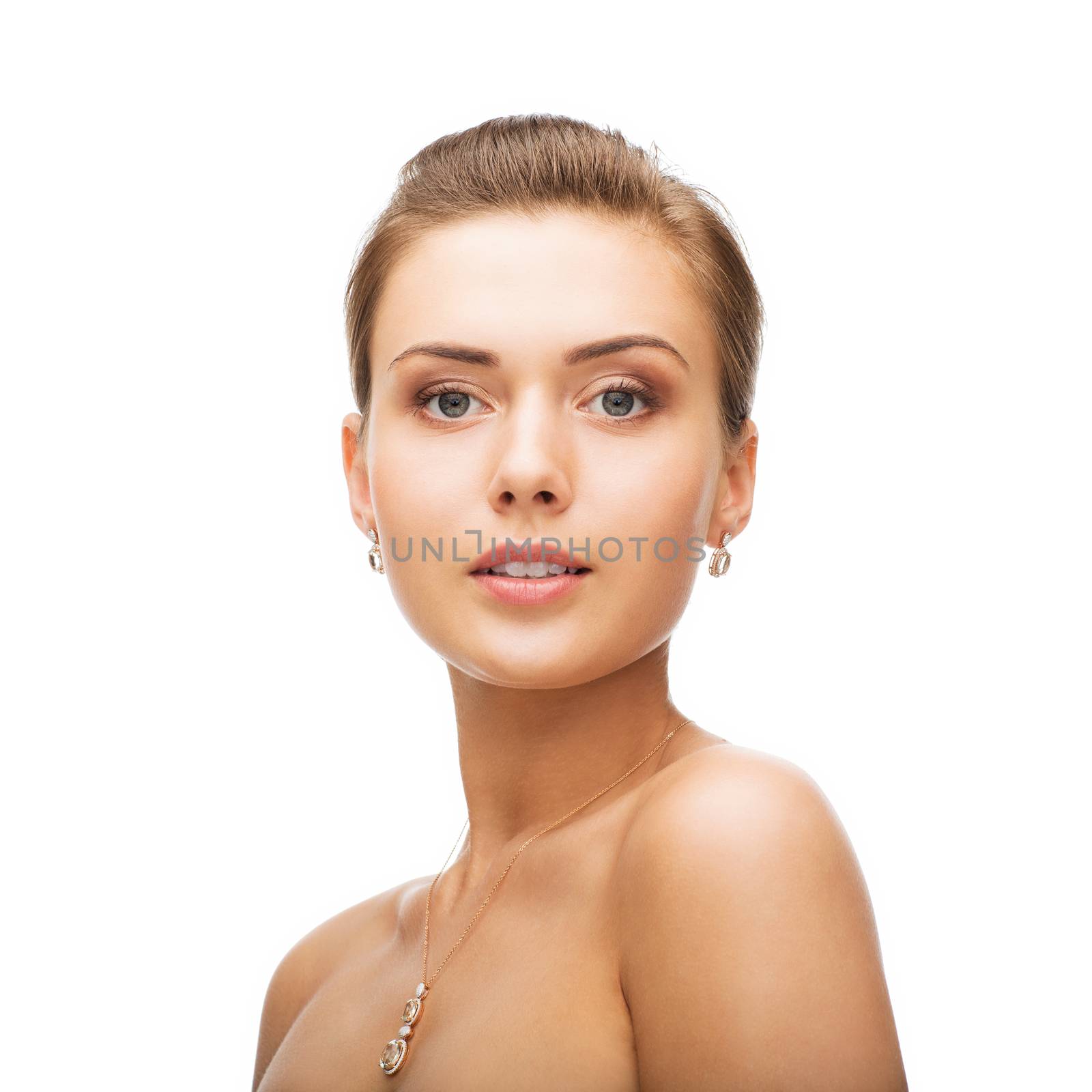 beauty and jewelry concept - woman wearing shiny diamond earrings