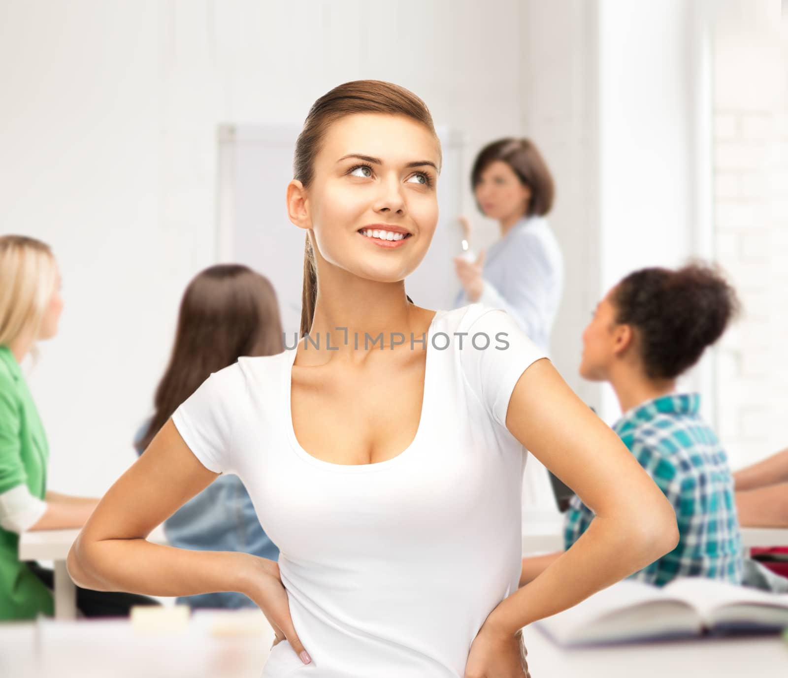 student girl in blank white t-shirt at school by dolgachov