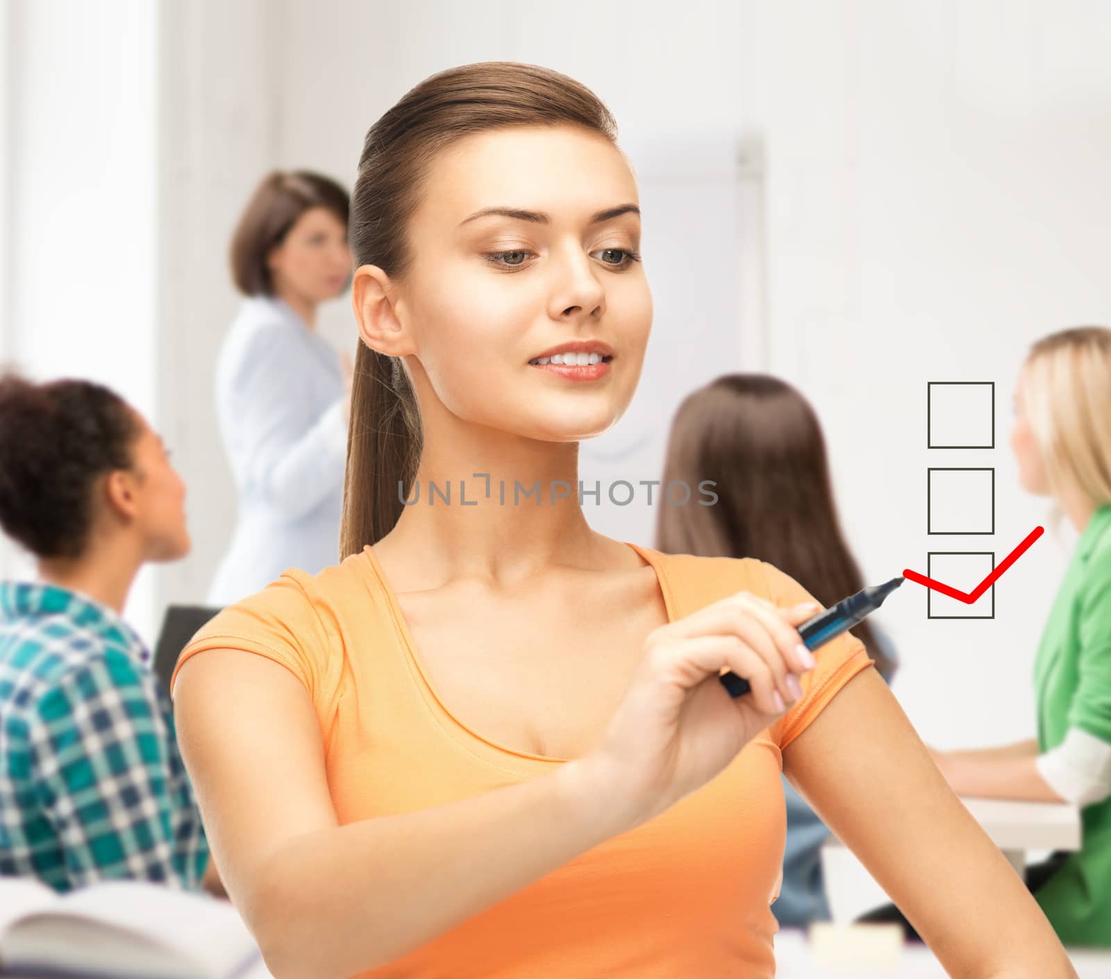 education and technology concept - student drawing checkmark on virtual screen