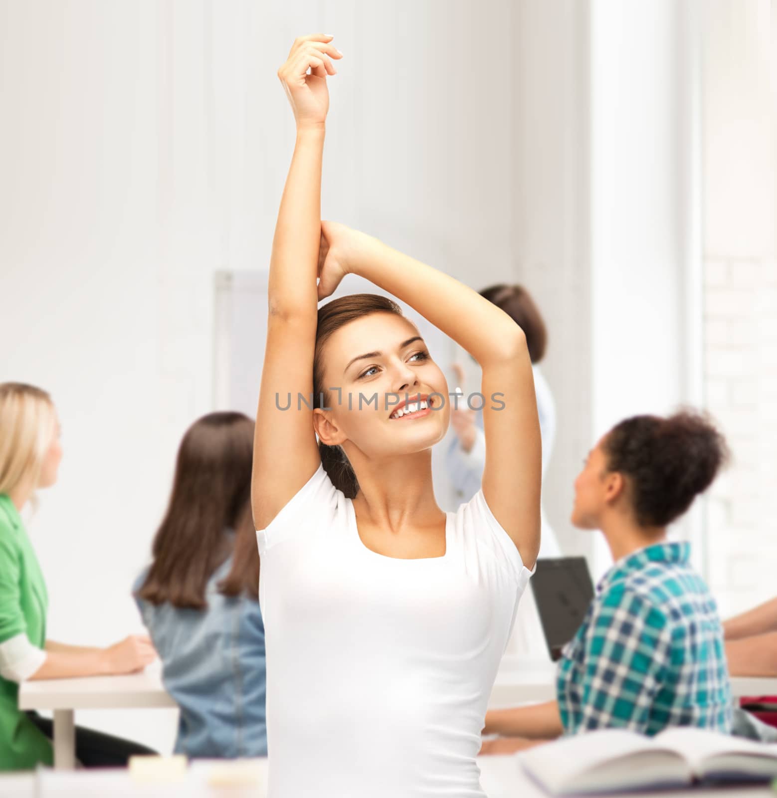 education and success concept - happy student girl with hands up