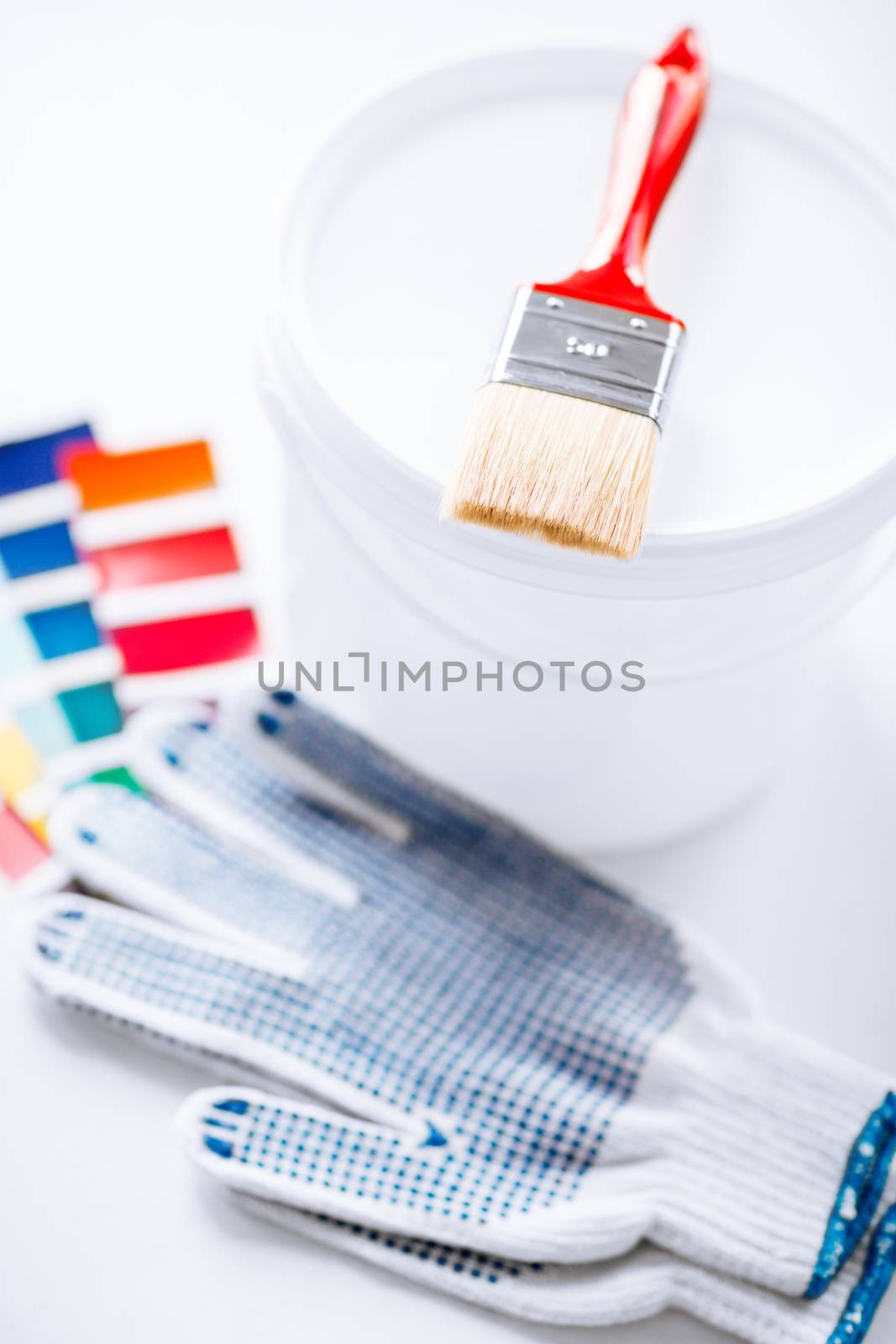 paintbrush, paint pot, gloves and pantone samples by dolgachov